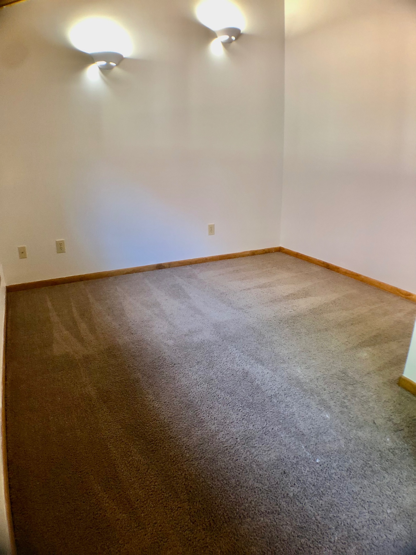 2040 Iuka Ave House bedroom with wall sconces and carpet