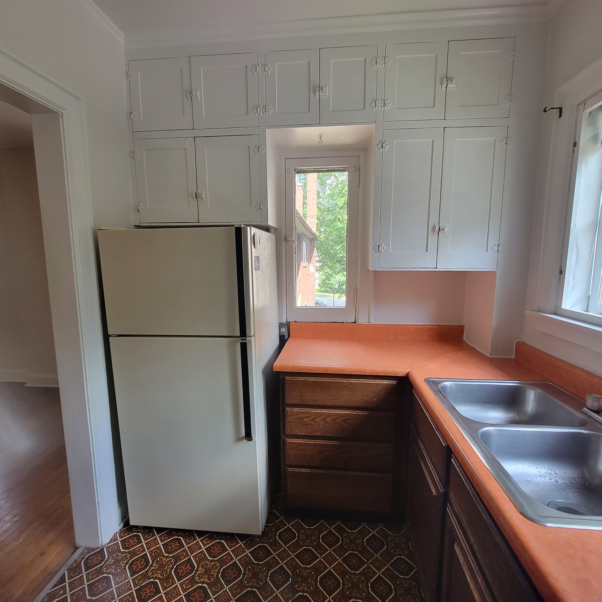 2048 Iuka Ave. C kitchen with refrigerator, sink, and wraparound counter space