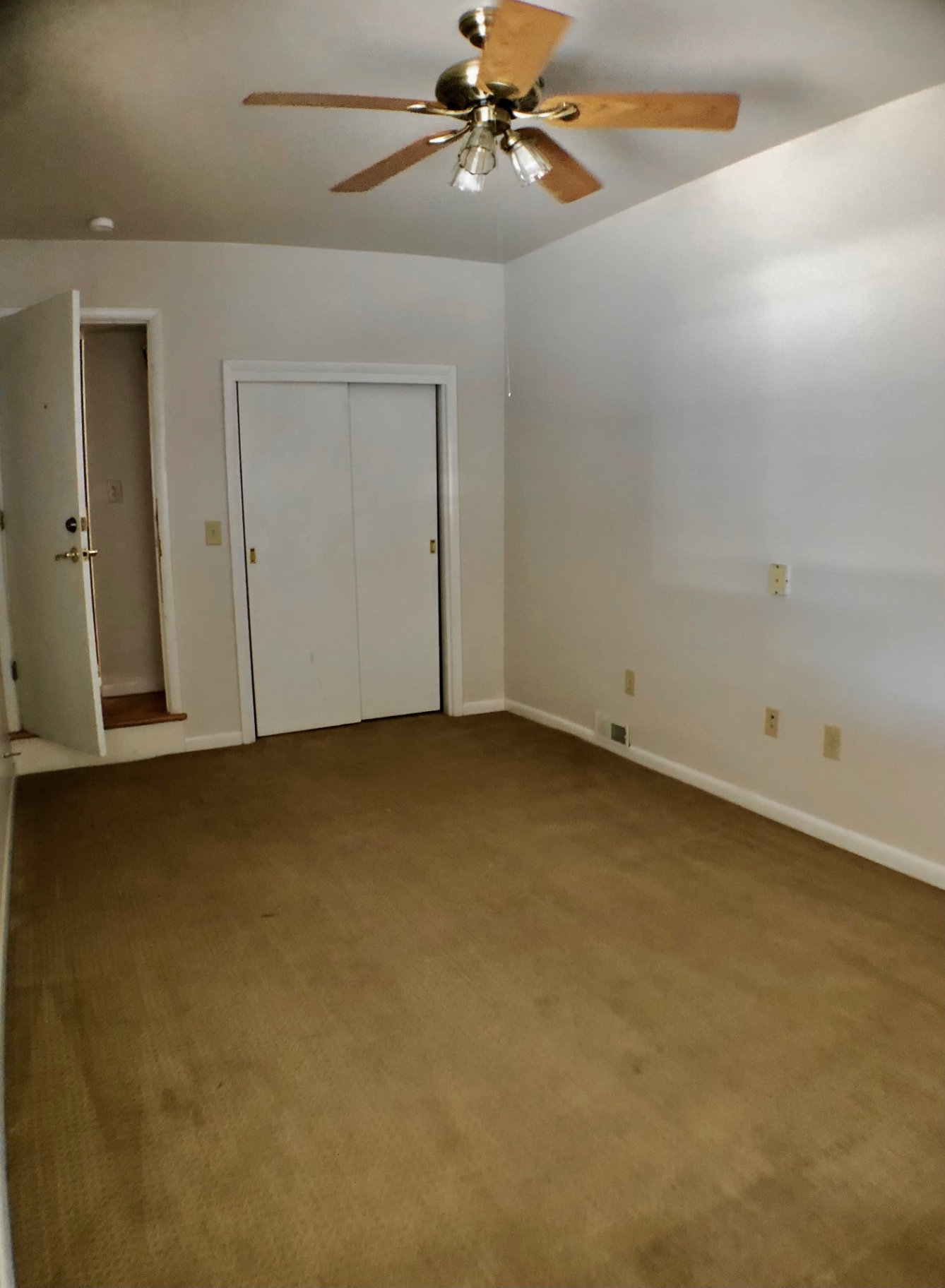 2040 Iuka Ave House bedroom with ceiling fan and double-door closet