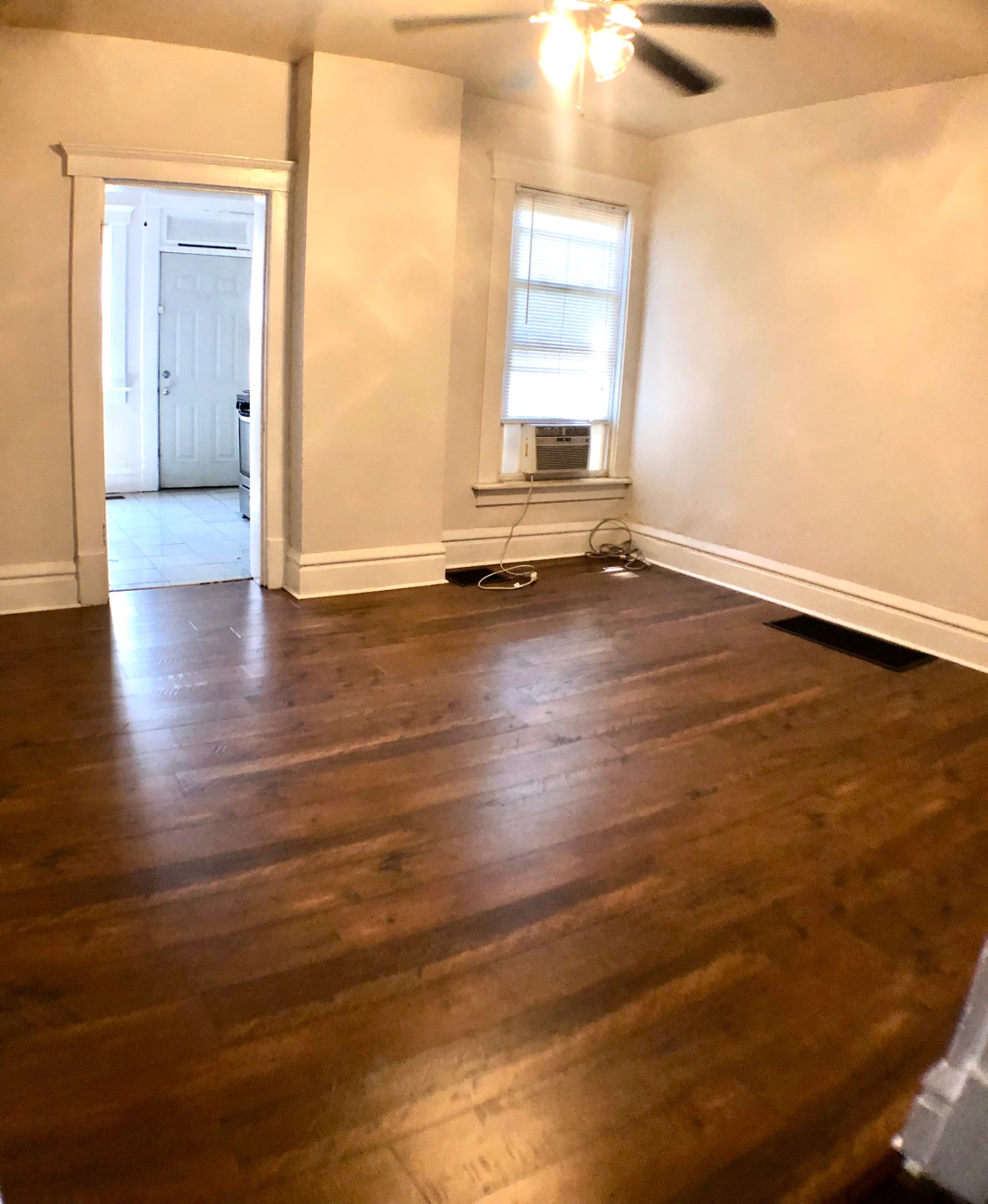 117 W 9th flex room with hardwood floors and ceiling fan