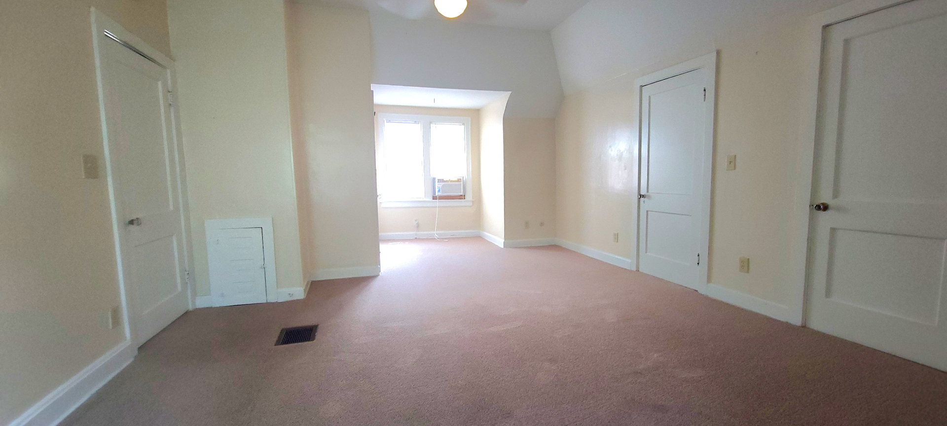 2054 Iuka Ave. C bedroom view toward the window alcove and dual closet doors