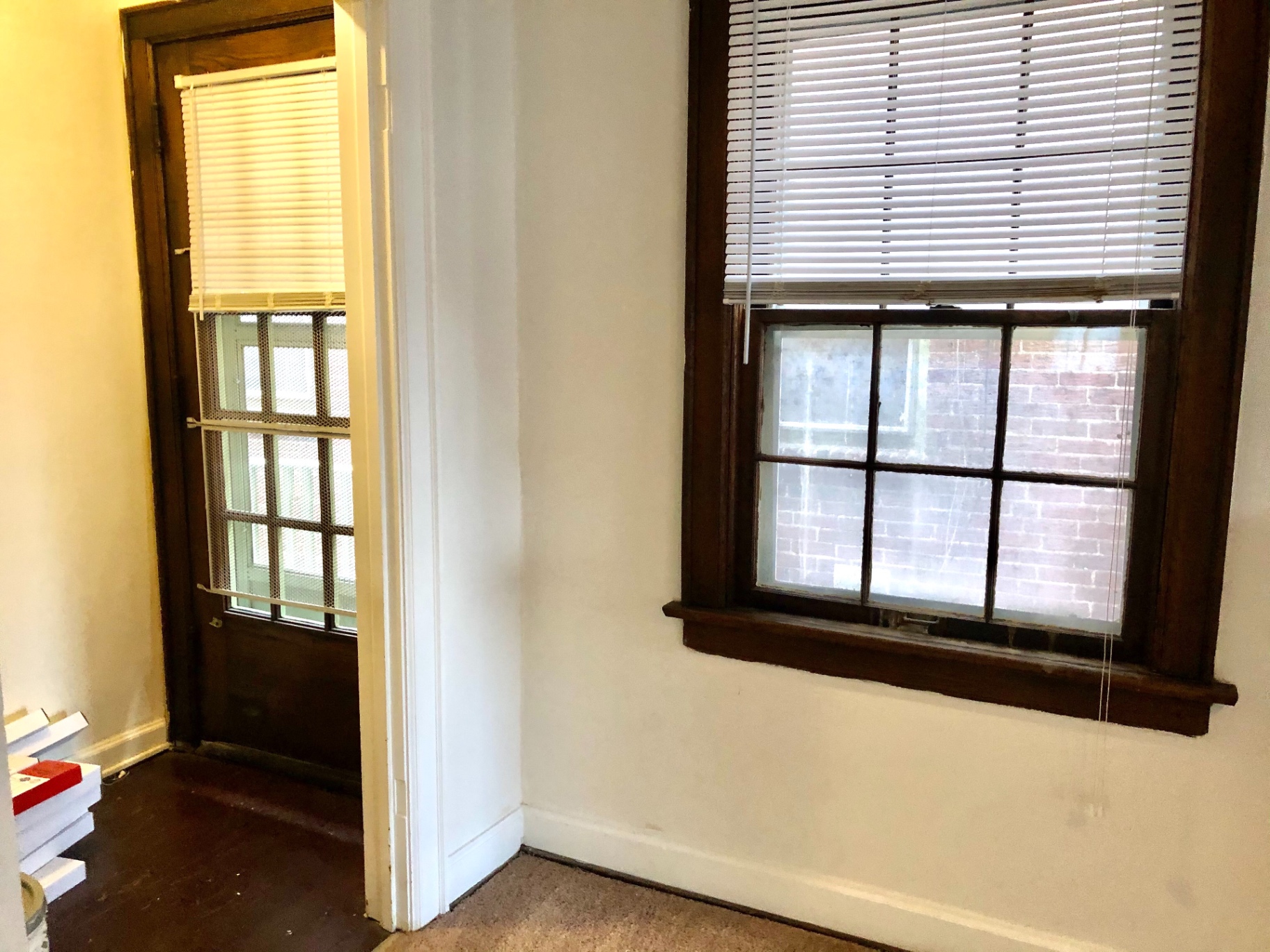 2044 Iuka Ave. B bedroom with private entry door and large wood-trim window