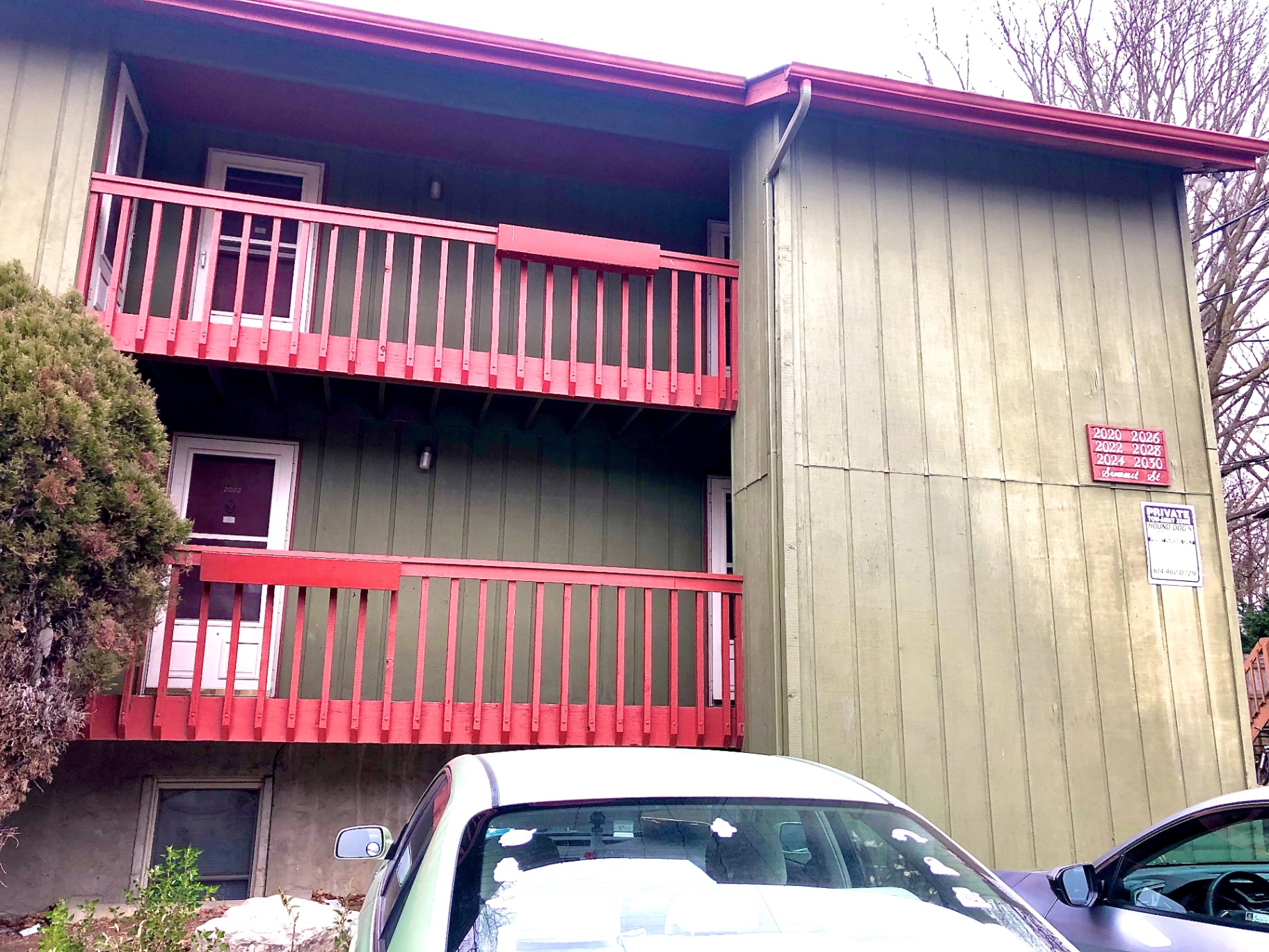 2026 Summit St. exterior — green building with red balconies and Summit St. address plaque