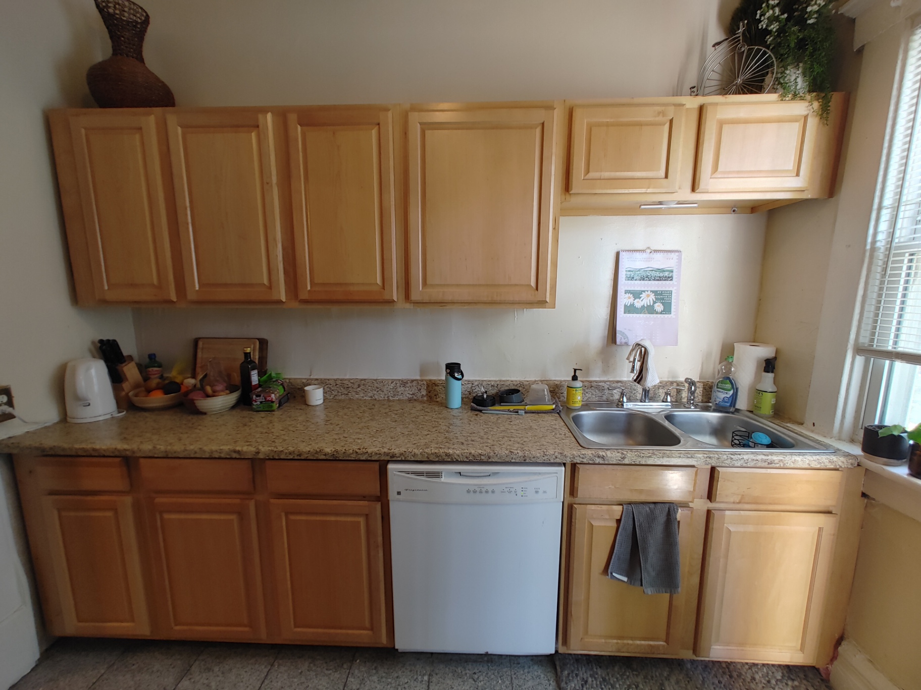 117 W 9th kitchen with maple cabinets, granite counters and double basin sink