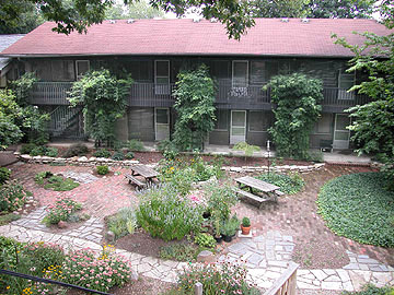 2040 Iuka Ave. 2A aerial view of vine-covered green building and landscaped courtyard