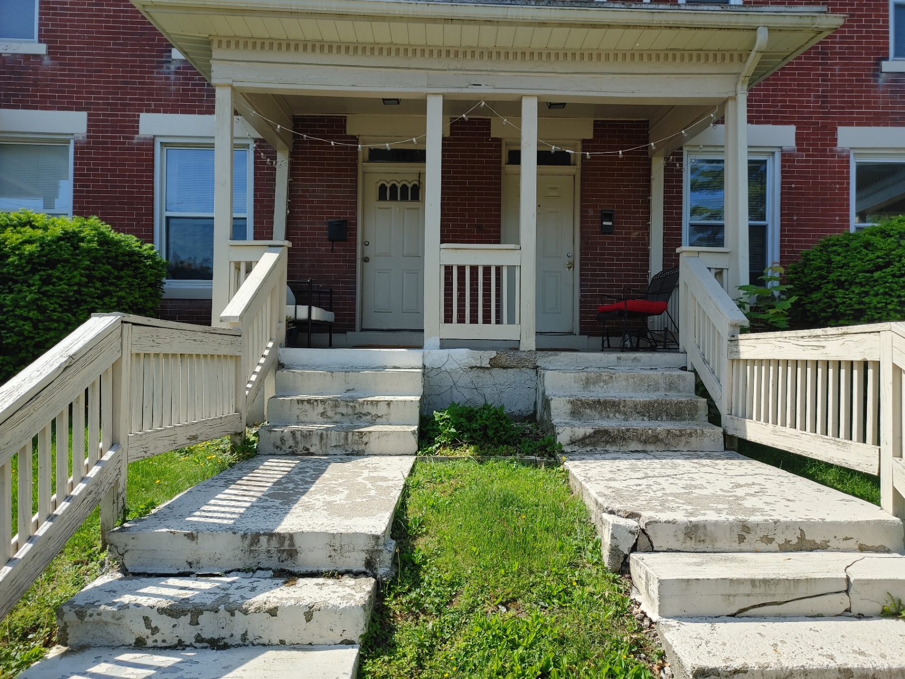 117 W 9th brick exterior with covered front porch