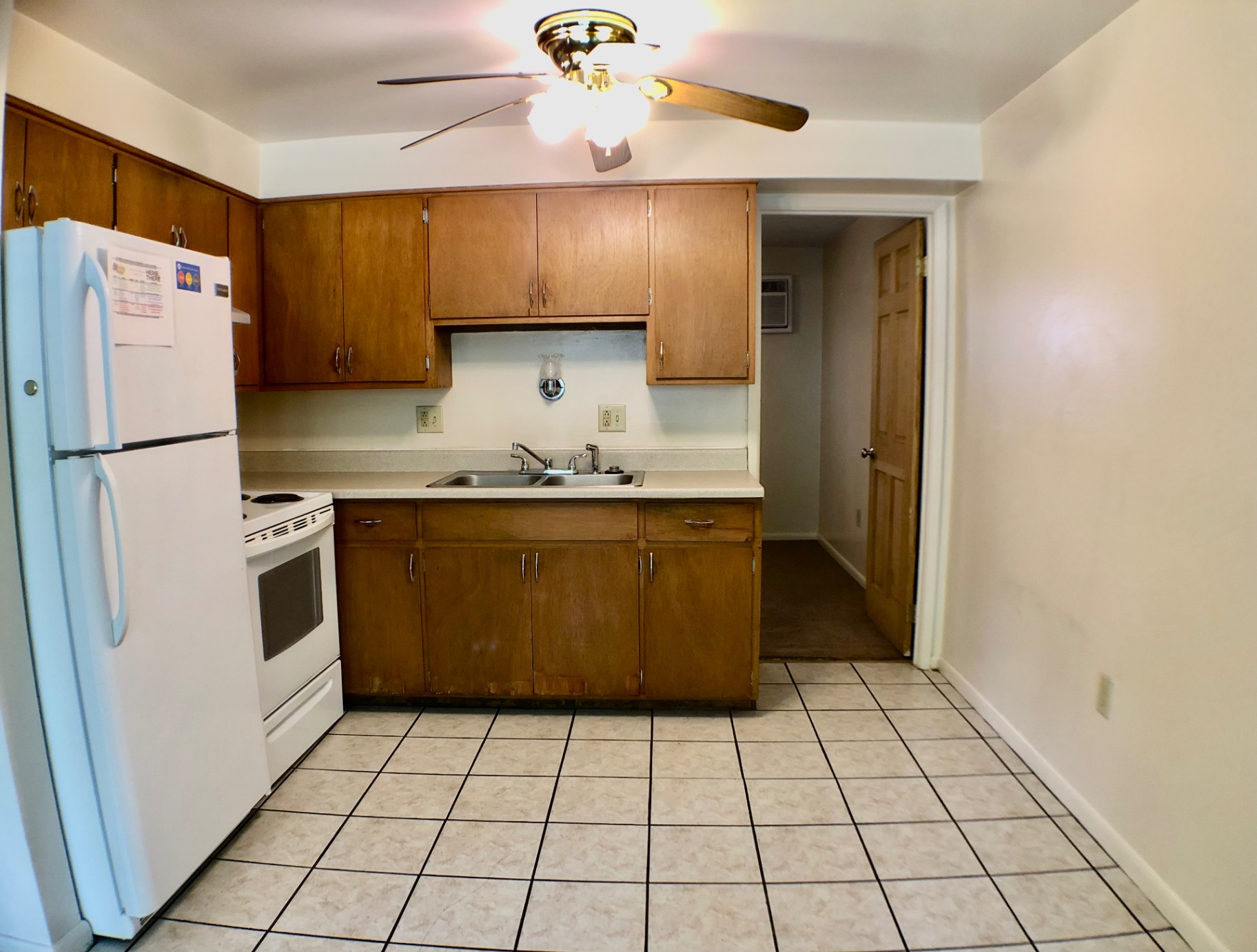 1827 N 4th St. Unit 1 kitchen view with double sink and pass-through to bedroom hallway