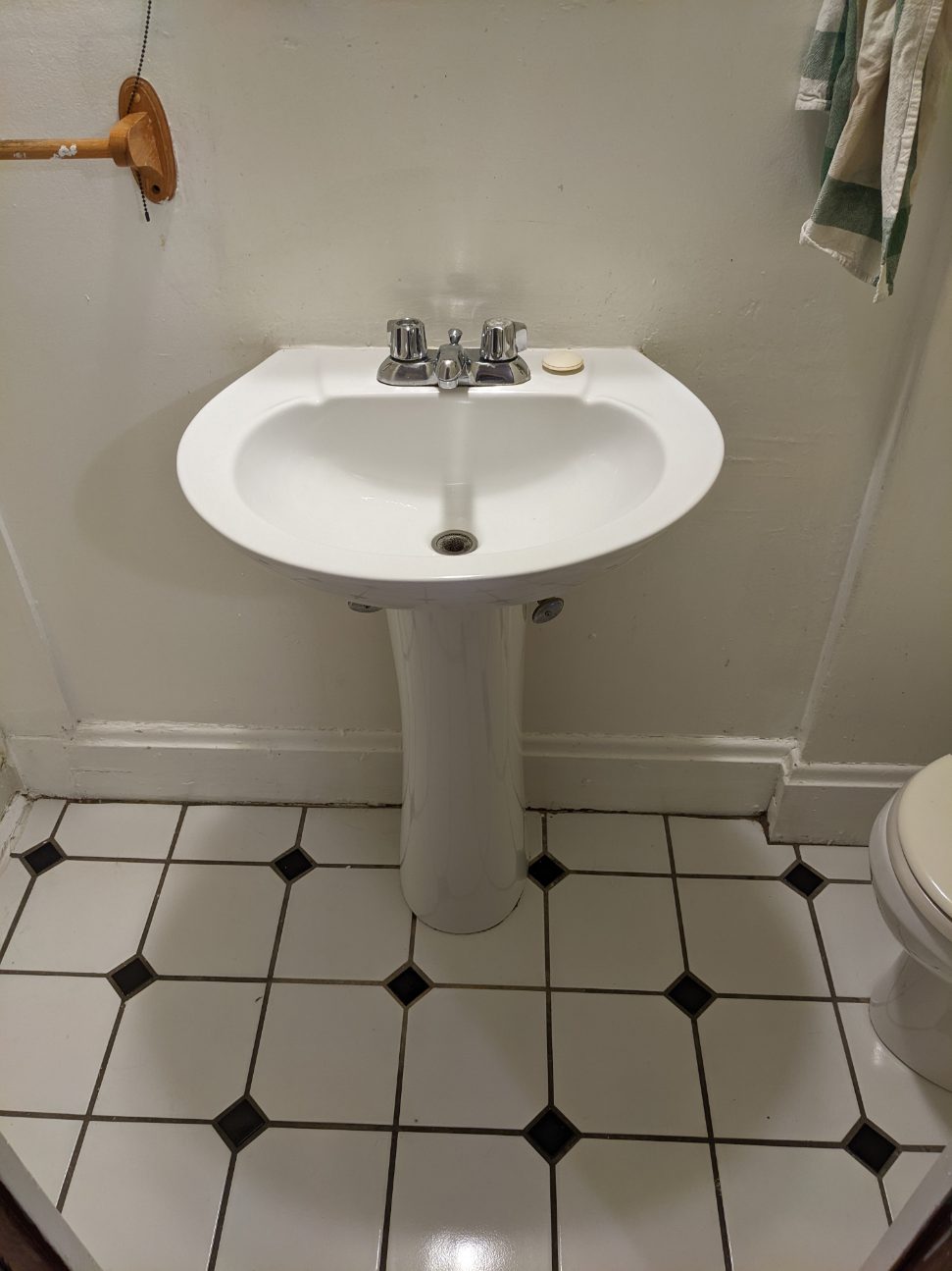 374 C E 14th Ave. bathroom pedestal sink with checkered tile floor