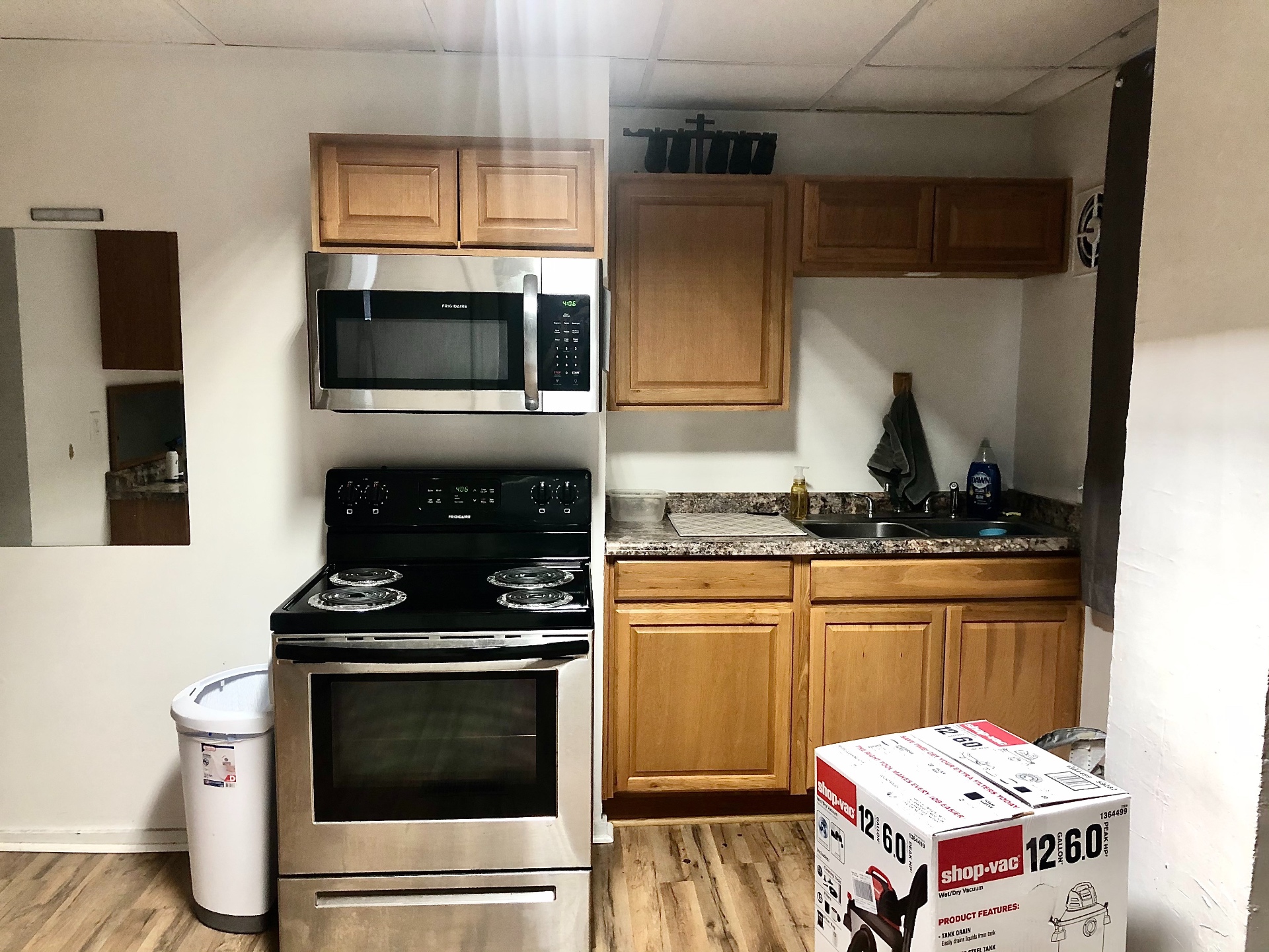 89 E Woodruff Ave. Unit 89 kitchen with stainless microwave, electric range, and granite counters