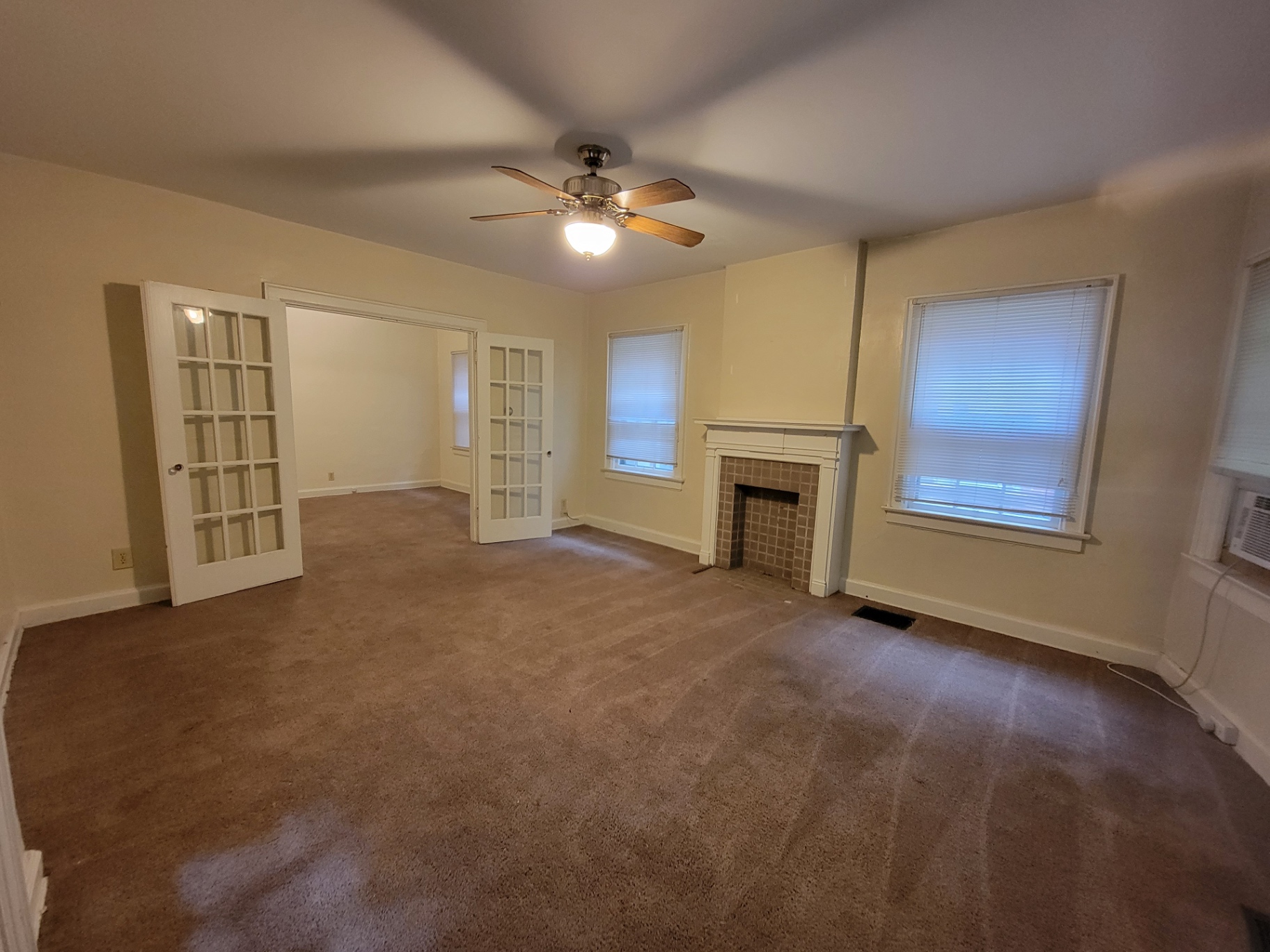 2048 Iuka Ave. B living room with French doors opening to the middle room