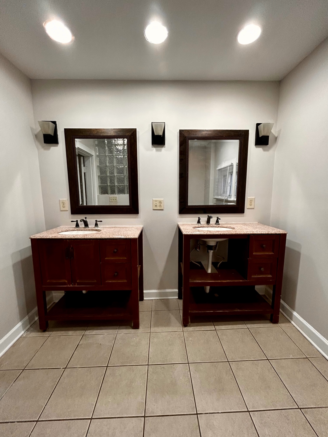 68 E Patterson Ave. bathroom with double vanities, granite tops, and framed mirrors