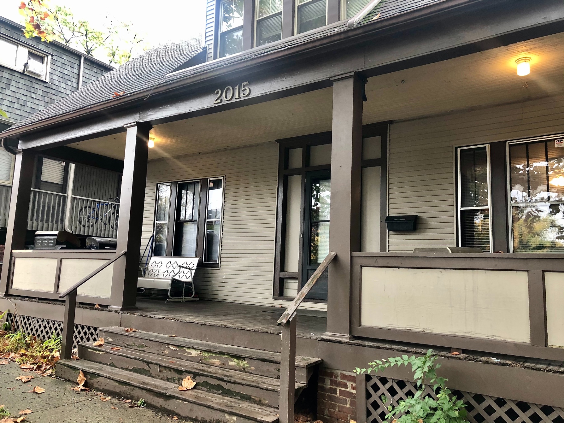 2015 Summit St. front porch with address numbers, porch swing, and covered entry