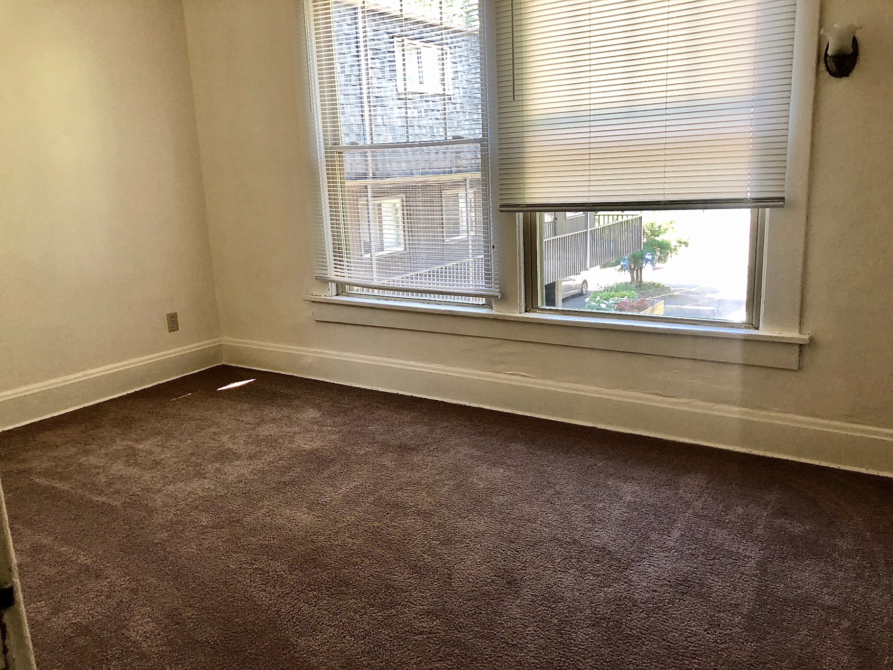 2015 Summit St. carpeted bedroom with large windows overlooking the street