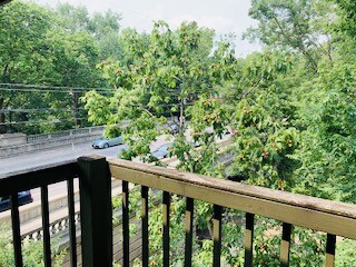 2026 Summit St. private balcony view overlooking the wooded Iuka Ravine