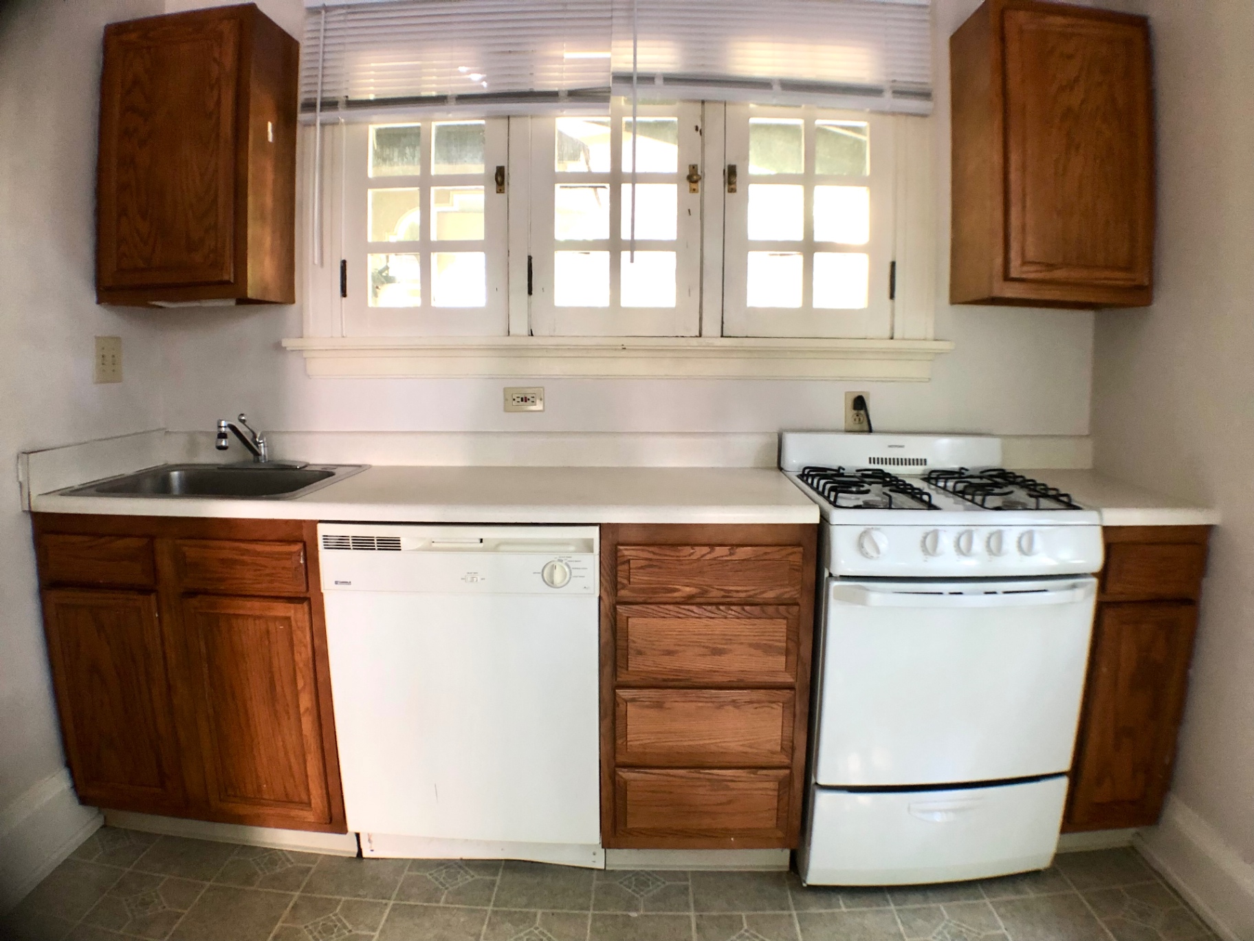 2026 Iuka Ave A kitchen with gas range, dishwasher, and oak cabinetry