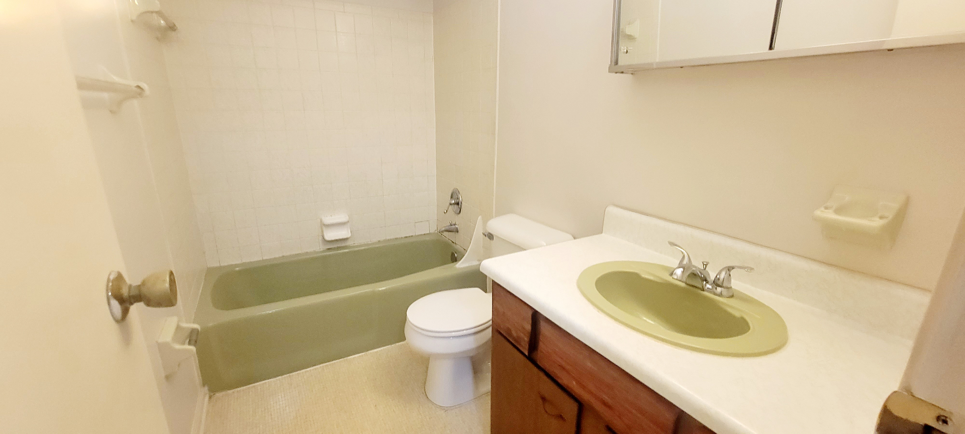 2022 Iuka Ave. full bathroom with tub-shower combo, vanity with medicine cabinet, and tile surround
