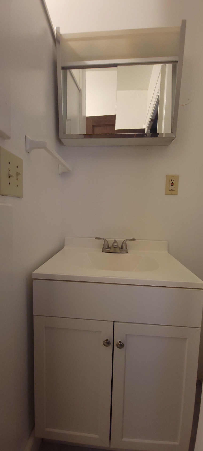 2054 Iuka Ave. C vanity with mirror and storage cabinet