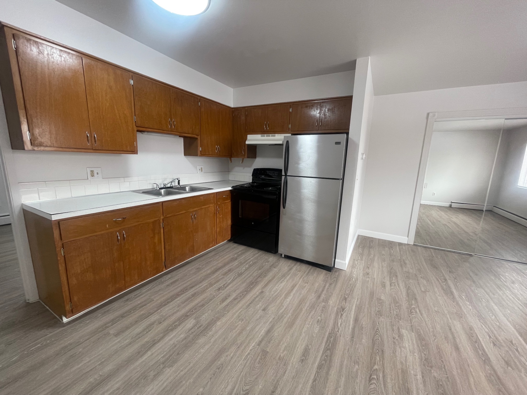 1827 N 4th St. Unit 8 kitchen view with stainless appliances and view into bedroom