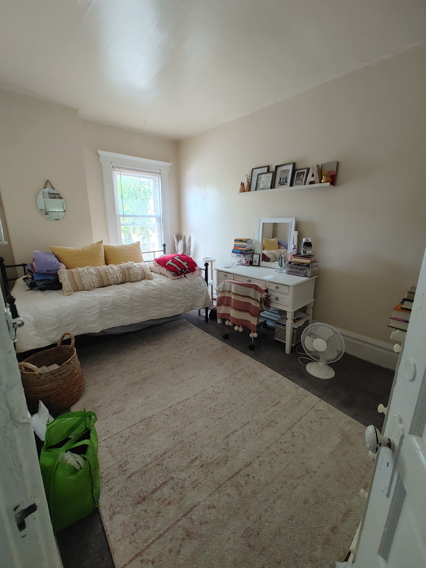 121 W 9th second bedroom with daybed, vanity, and bright window