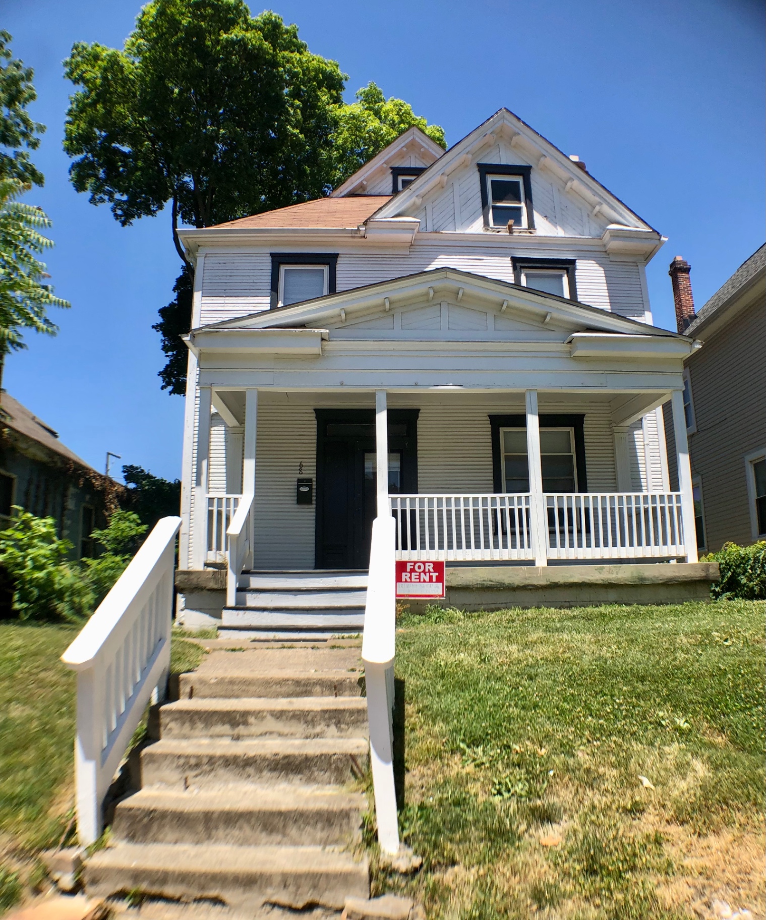 68 E Patterson Ave. white two-story house exterior with covered front porch