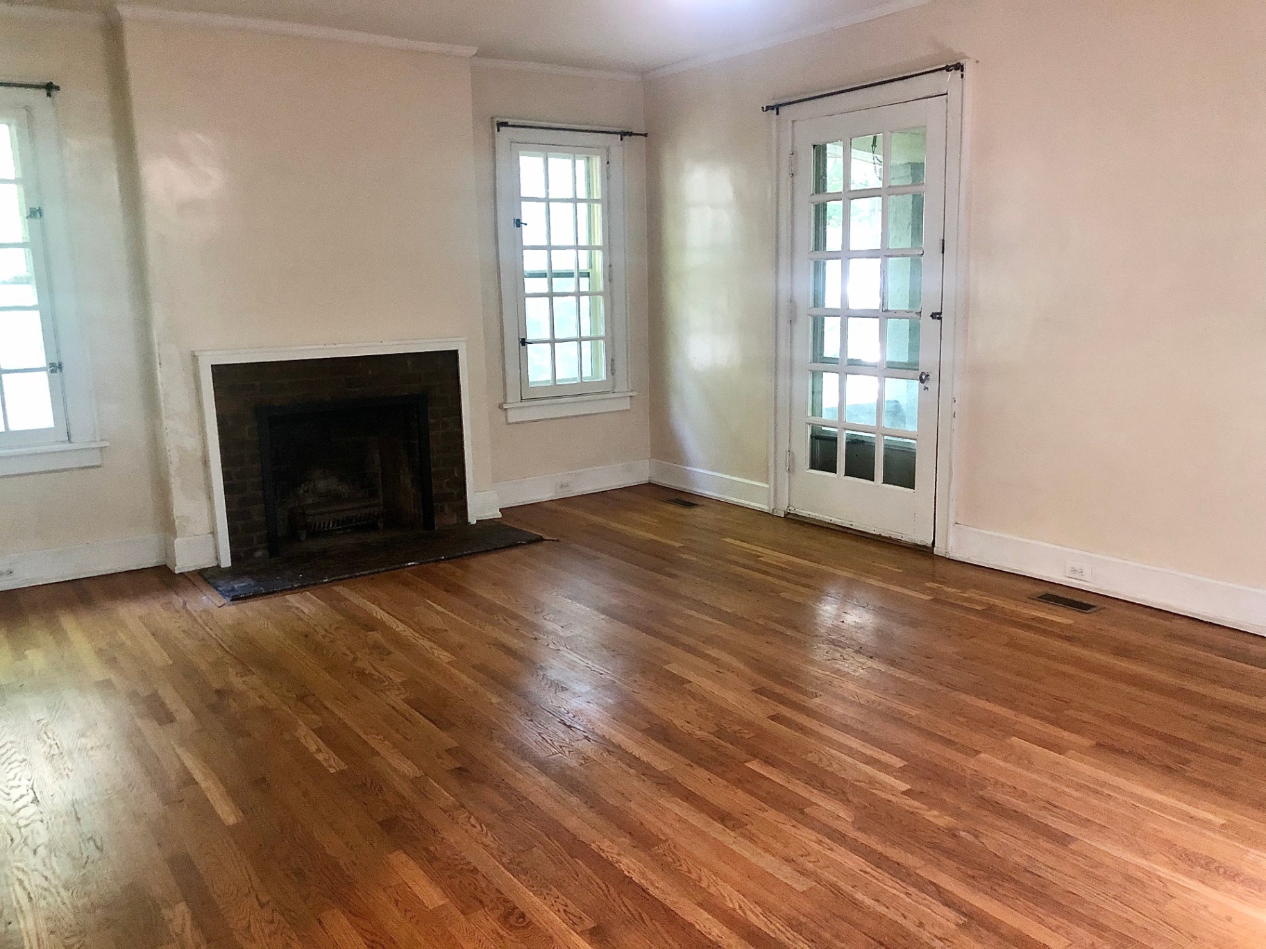 2034 Iuka Ave A living room with fireplace, hardwood floors, and French doors