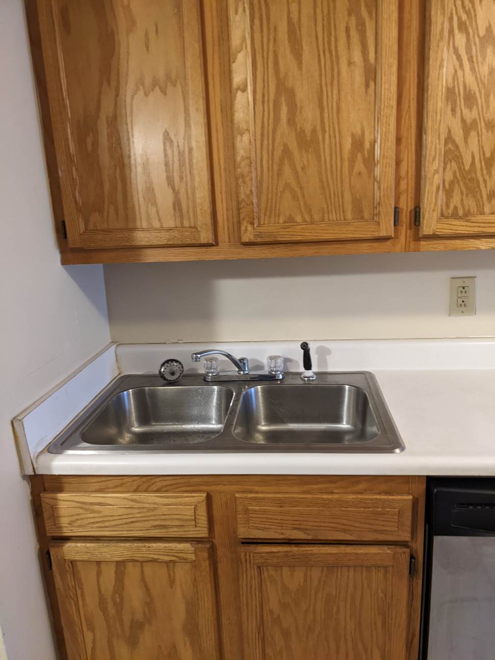 374 C E 14th Ave. kitchen with double stainless sink and oak cabinetry