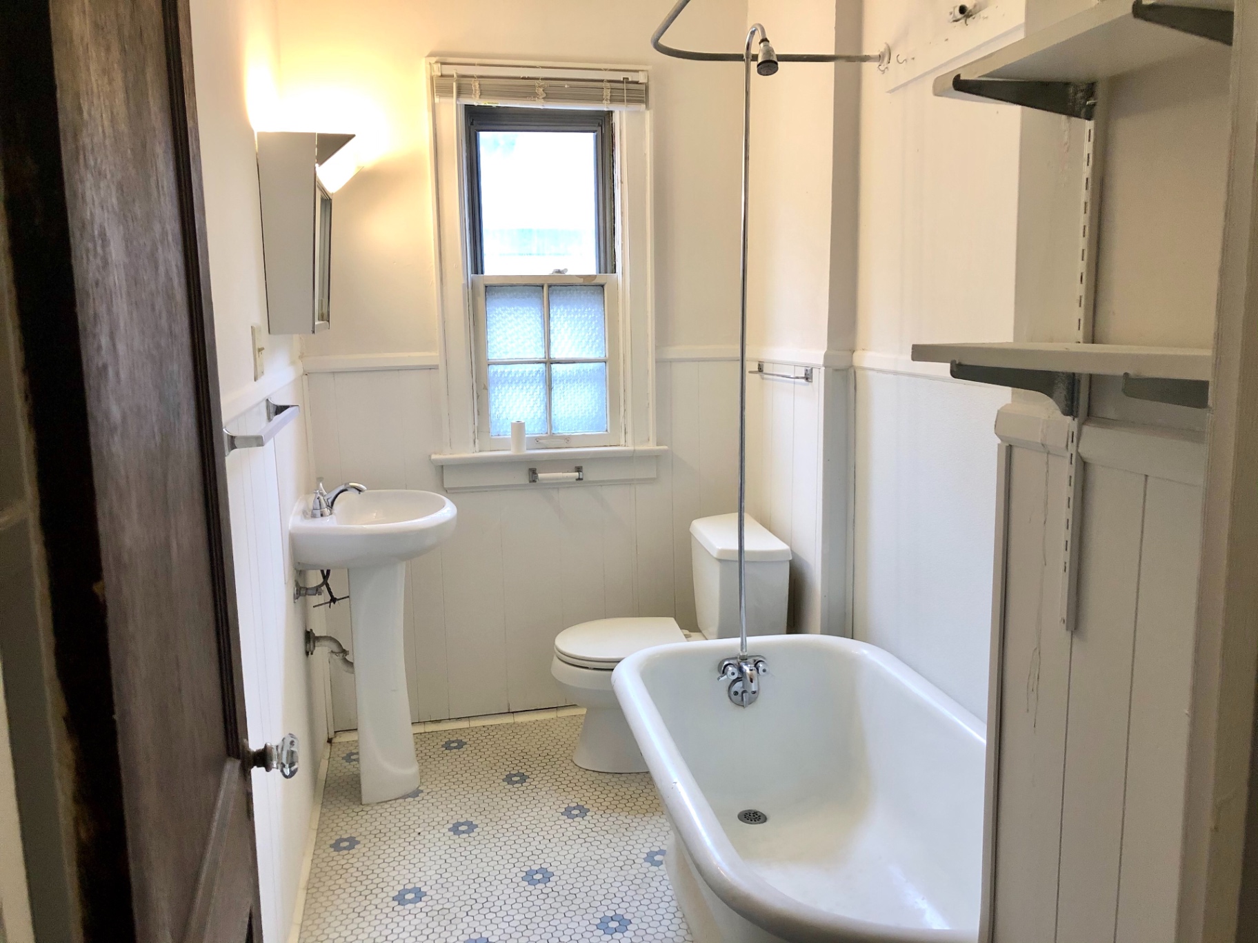 2044 Iuka Ave. B vintage bathroom with clawfoot tub, pedestal sink, and hex tile floor