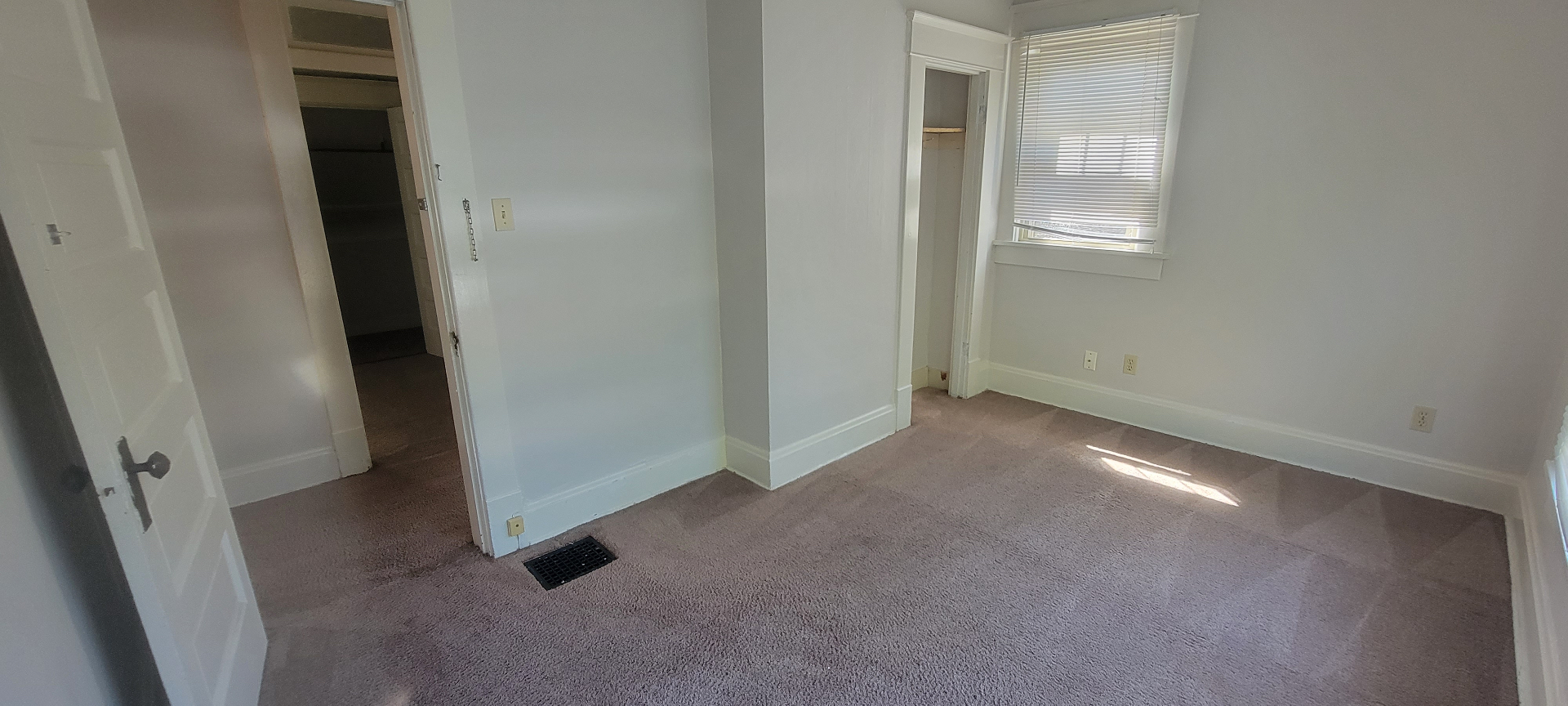 2015 Summit St. carpeted bedroom with closet access and bright corner window