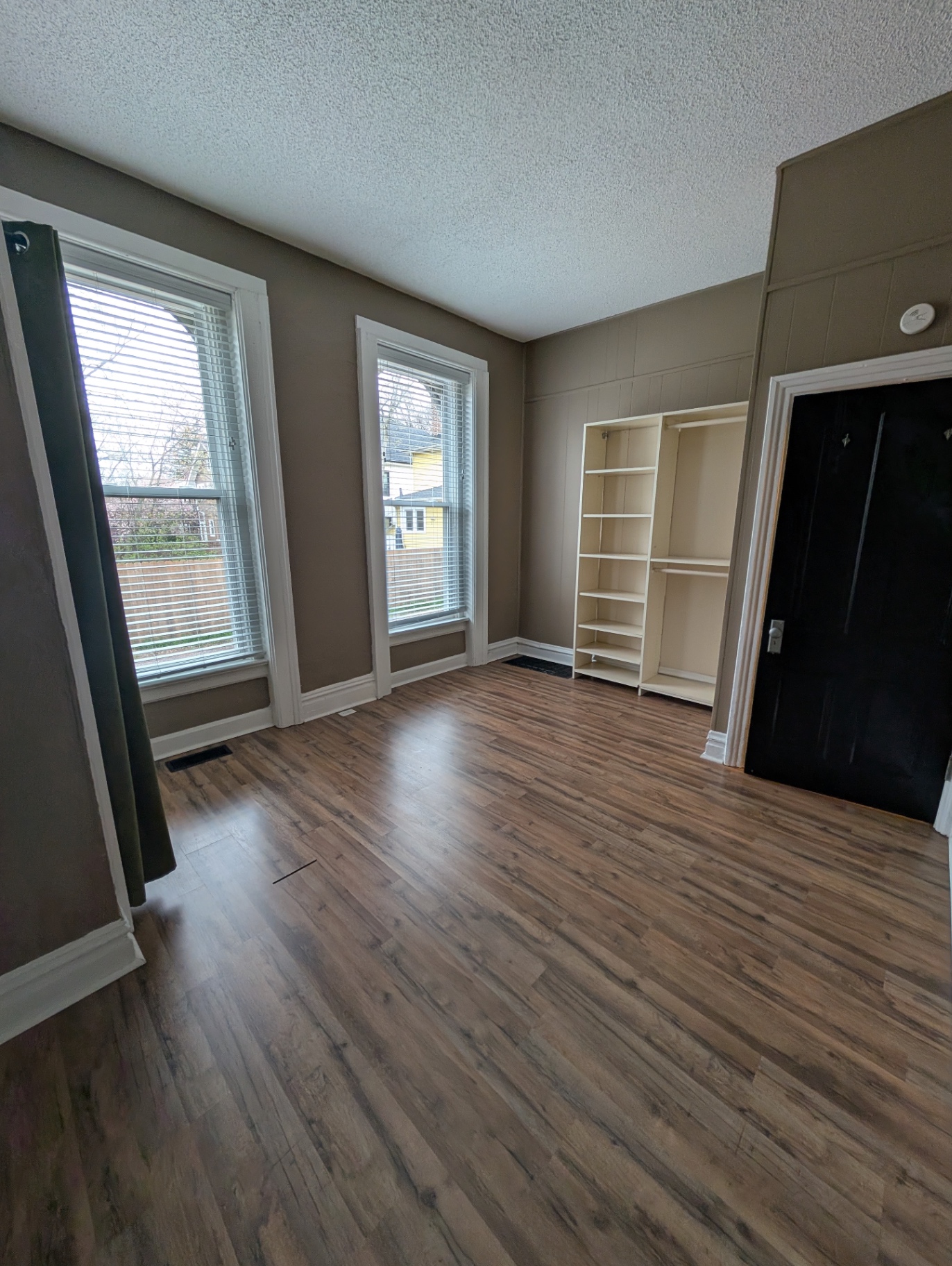 3338 Chestnut Downstairs second bedroom with built-in shelving and dual windows