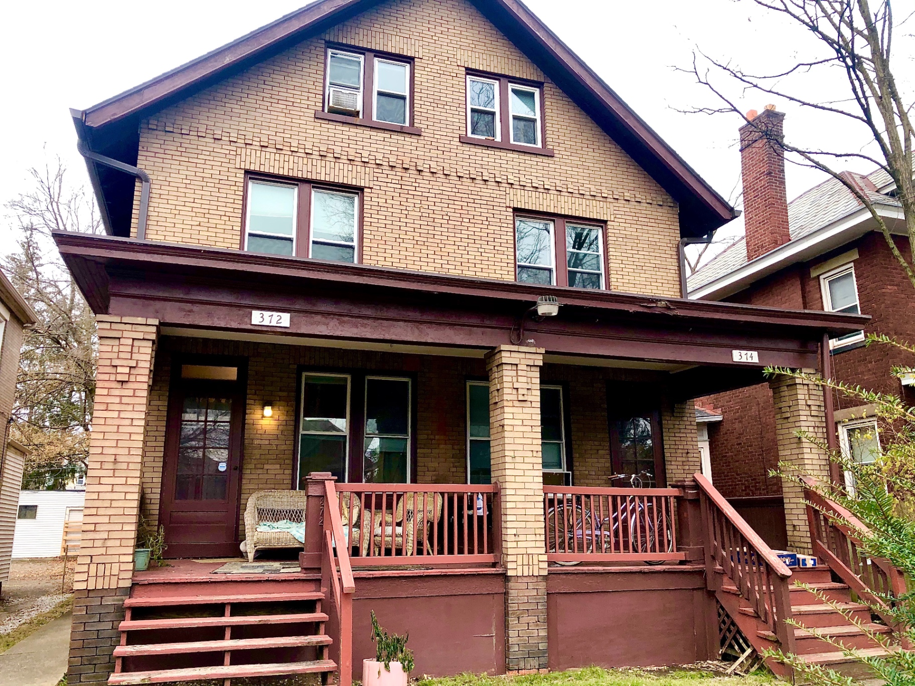 372 E 14th Ave. brick two-story house exterior with covered front porch
