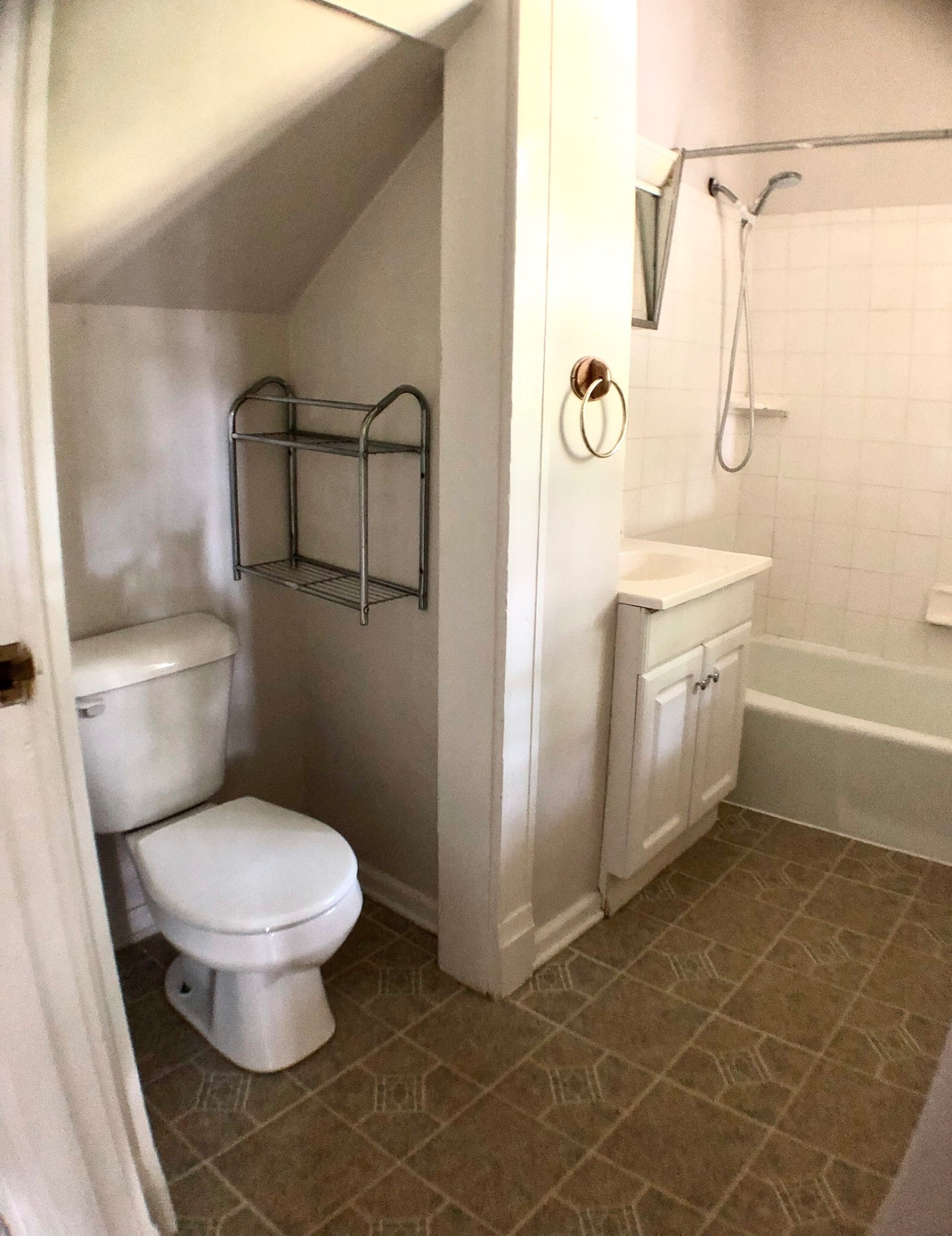 2026 Iuka Ave A bathroom with tucked-in toilet nook and tub