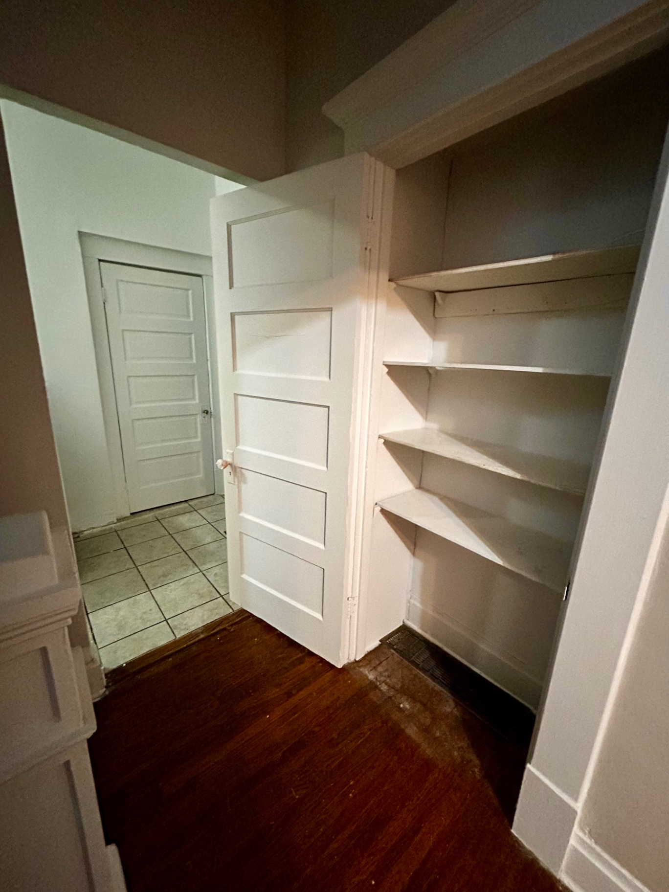 68 E Patterson Ave. built-in shelving pantry with paneled door and hardwood floors
