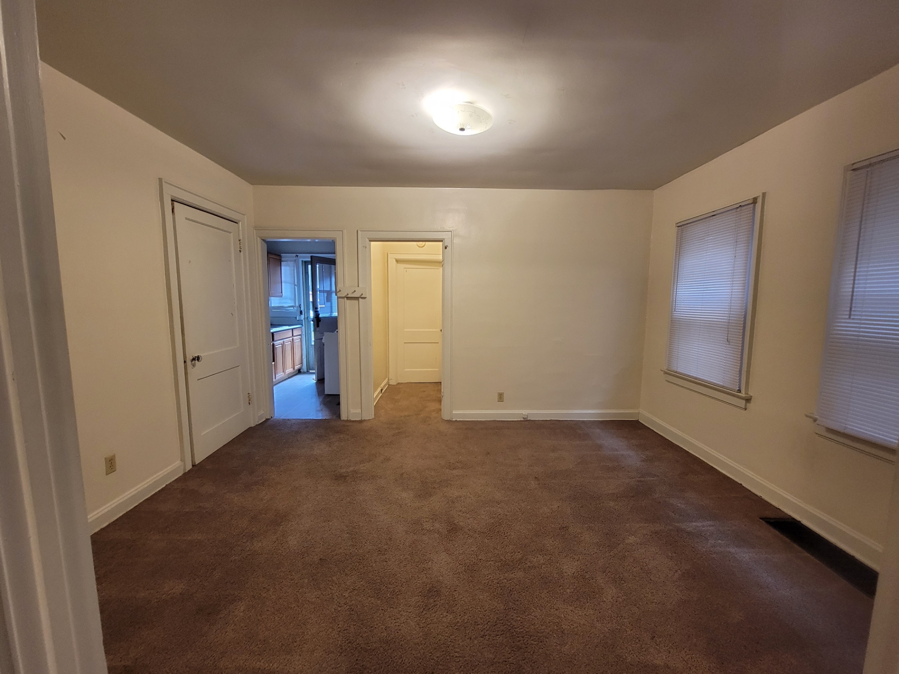 2048 Iuka Ave. B middle room usable as dining or office, with doorways to kitchen and hallway