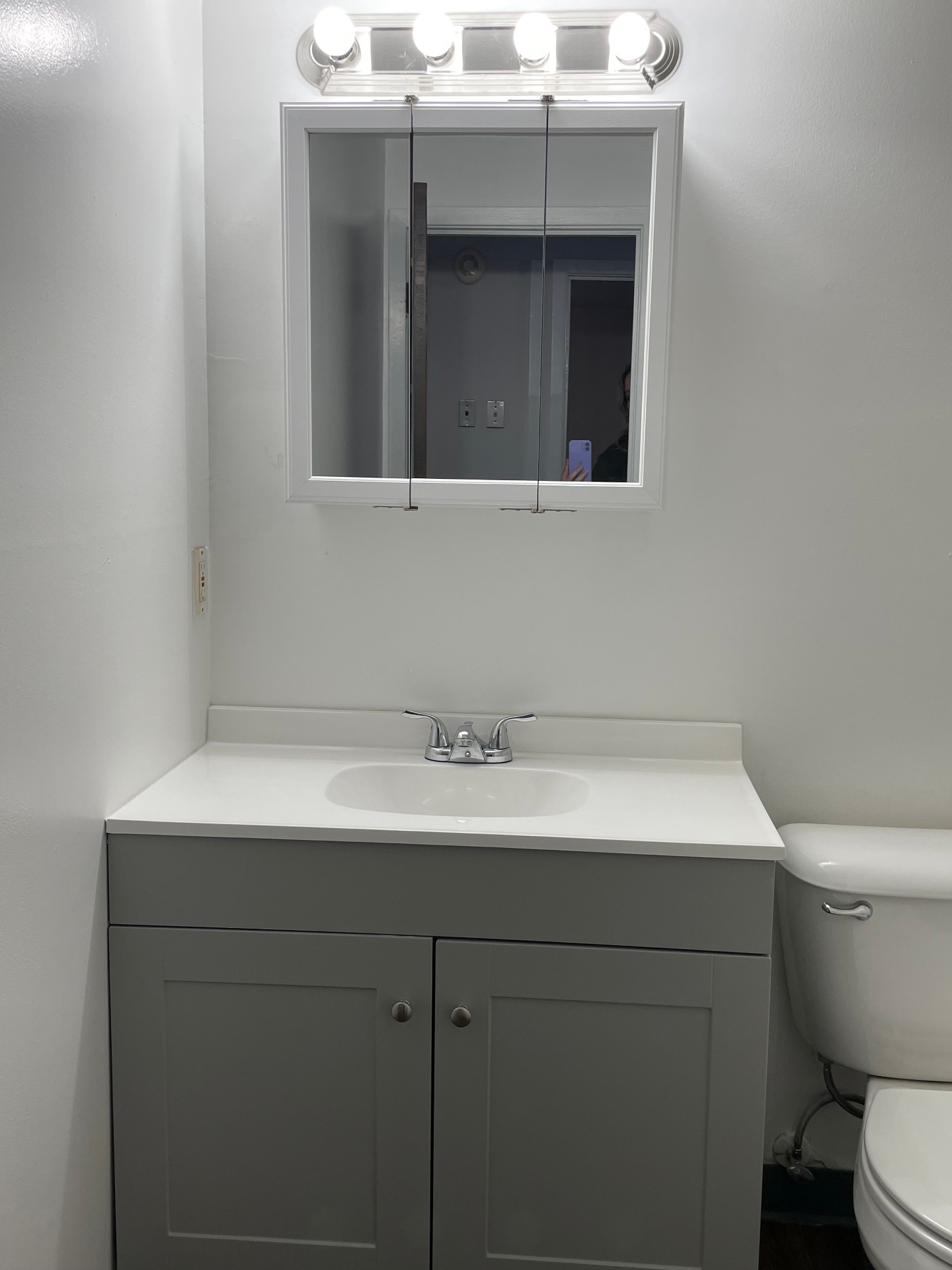 2020 Summit St. updated bathroom with grey shaker vanity, medicine cabinet, and new fixtures