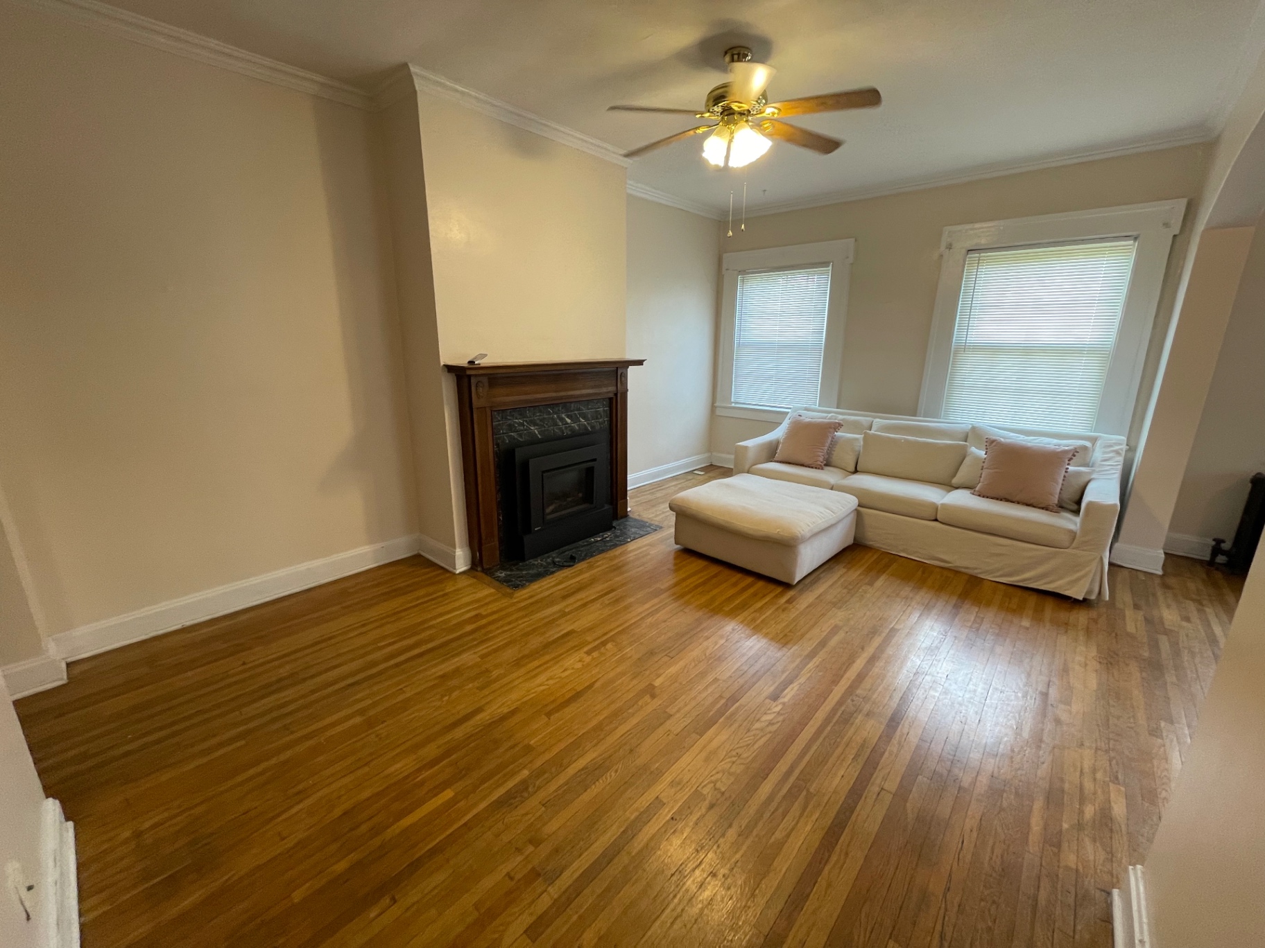 Unit E living room with gas insert fireplace