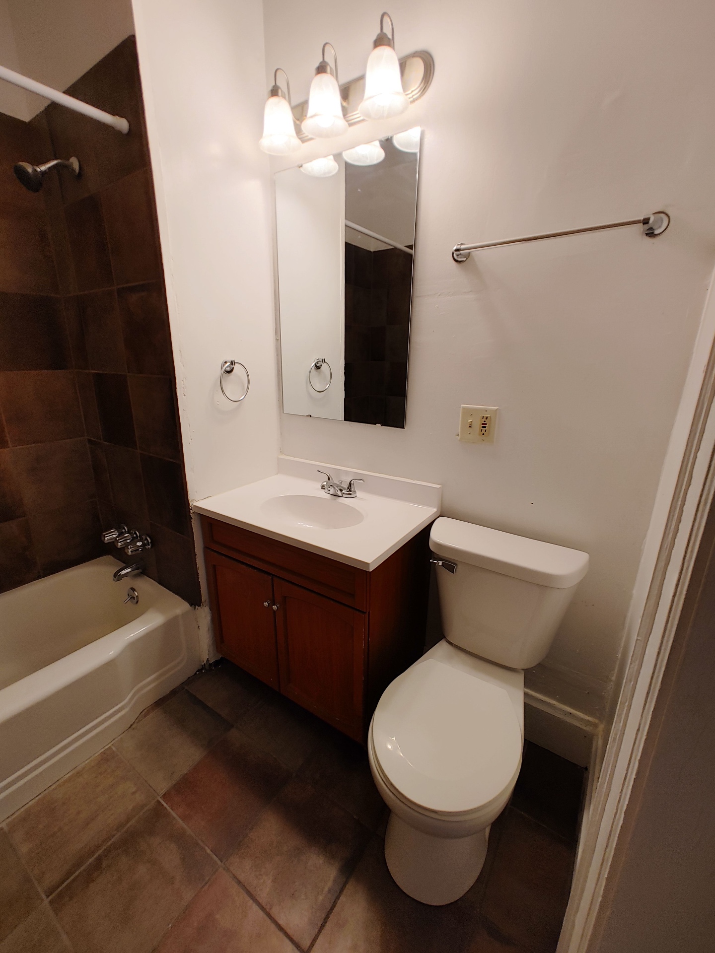 374 A E 14th Ave. bathroom vanity with mirror, vanity lighting, and tile floor
