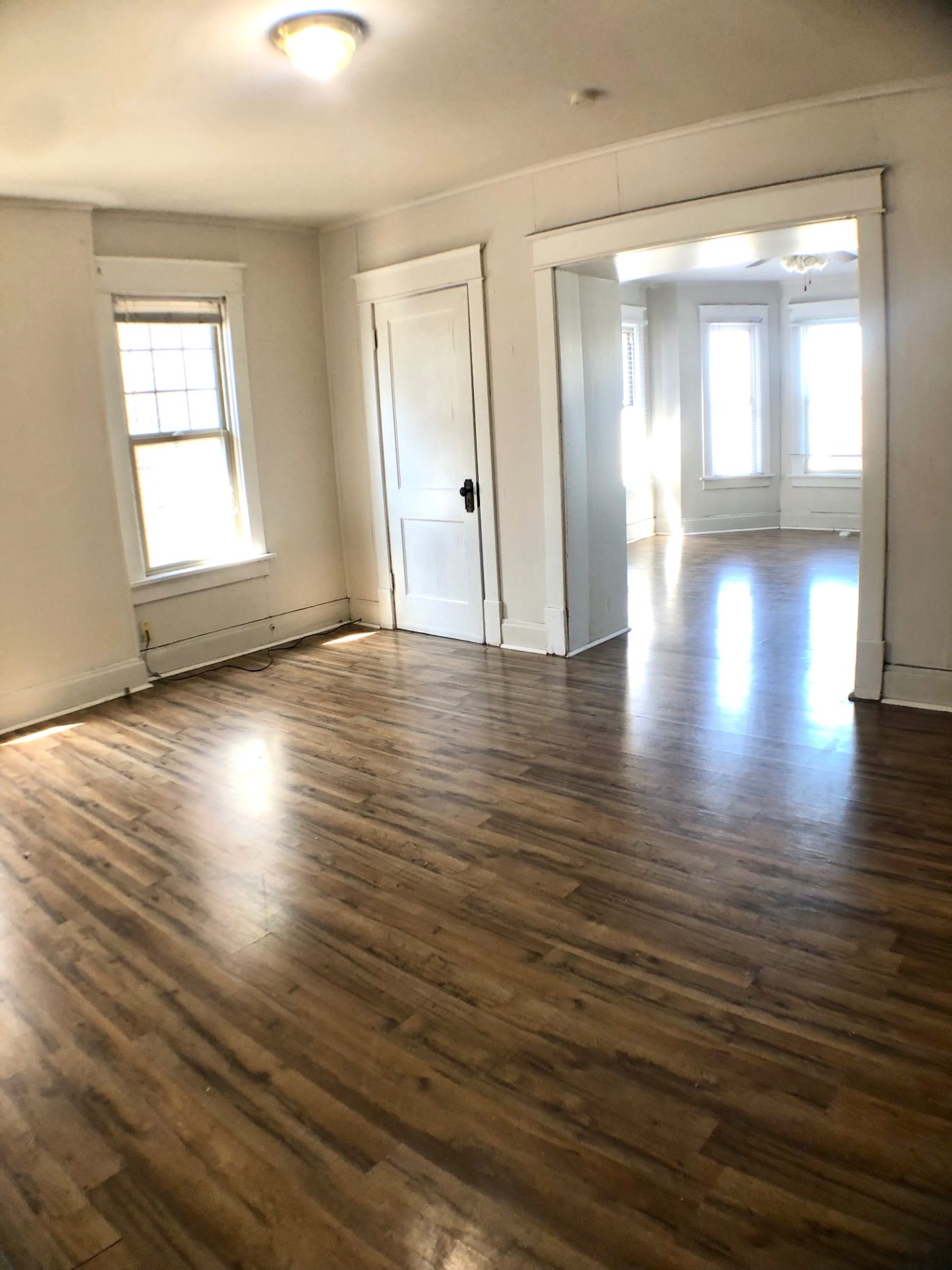 1814 Summit St. bonus front room with hardwood floors and open doorway to the living room