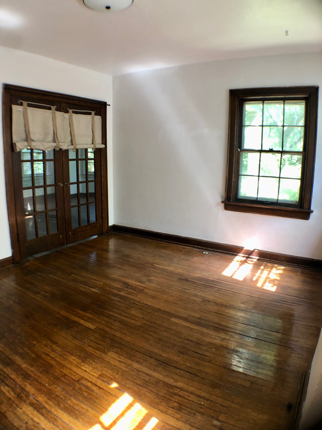 2044 Iuka Ave. A additional view of room with French doors and refinished hardwood floors
