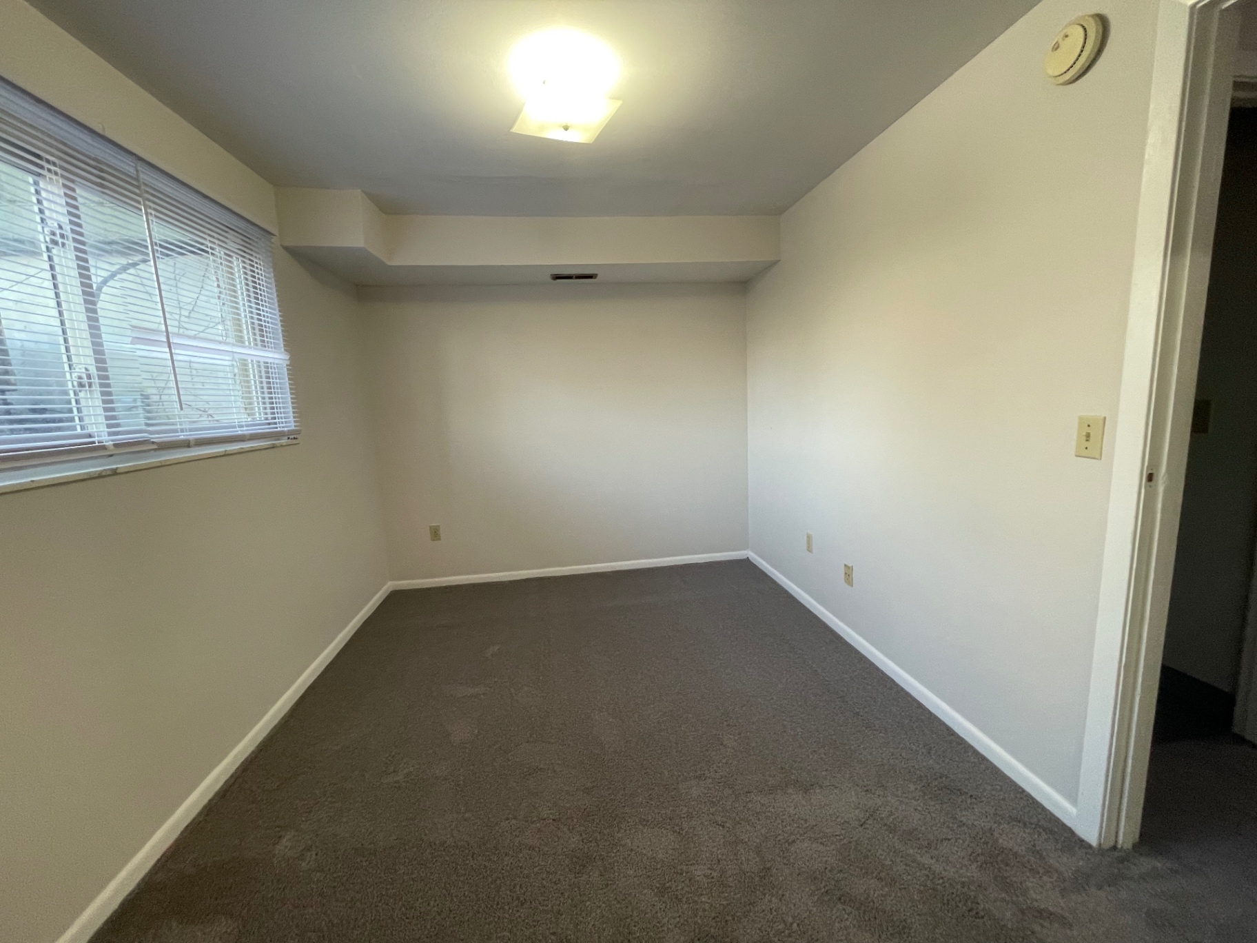 2020 Summit St. carpeted bedroom with large window overlooking the ravine