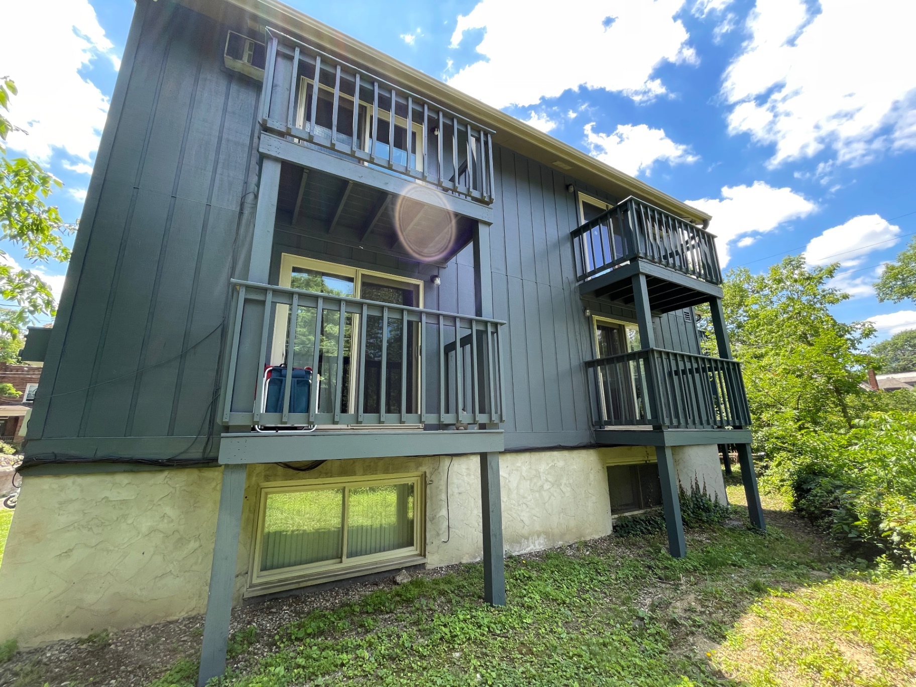 2020 Summit St. exterior showing private balconies overlooking the wooded Iuka Ravine