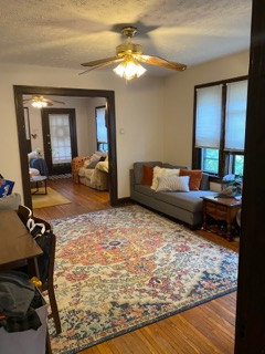 2155 N 4th St. living room with sectional sofa and colorful area rug