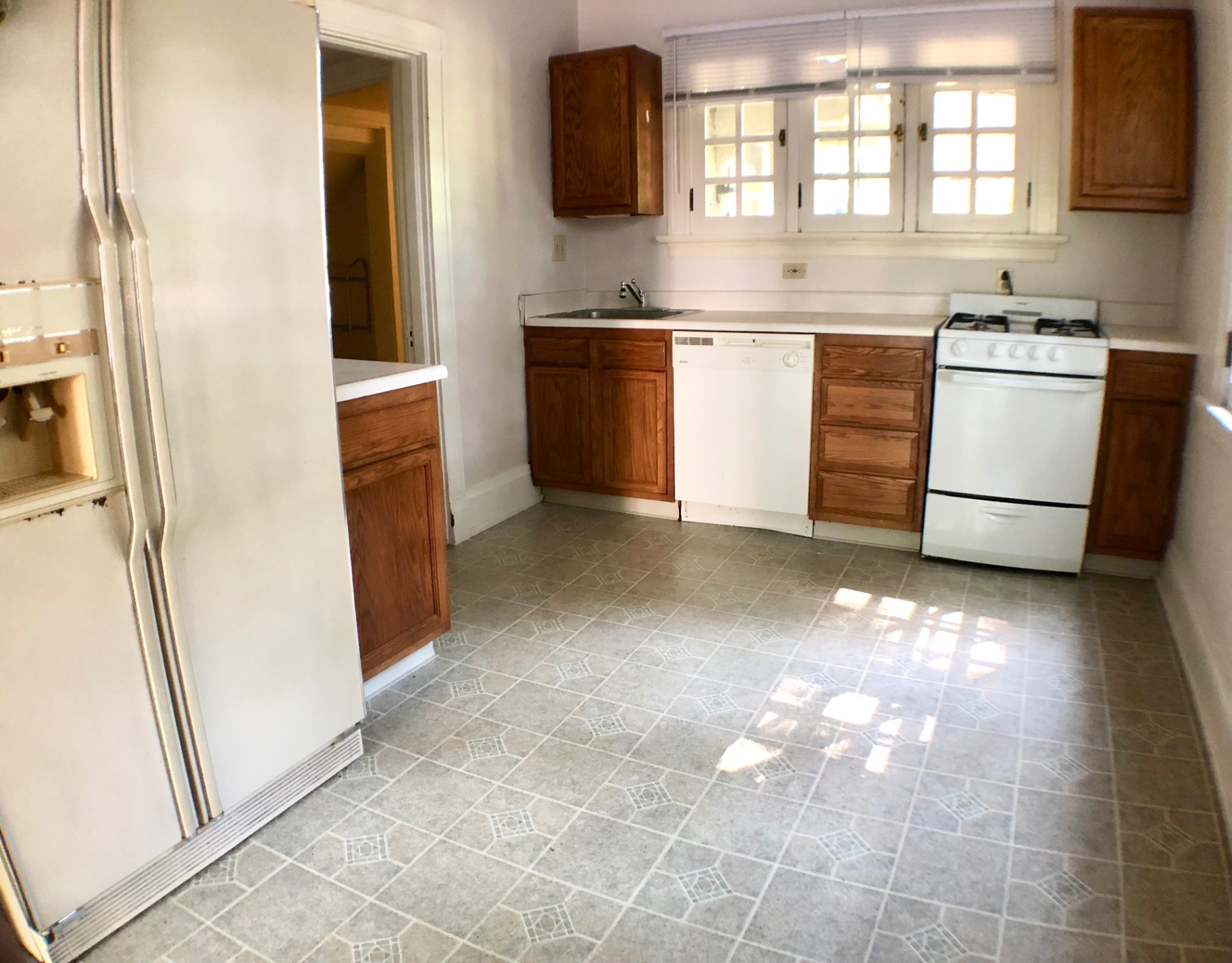 2026 Iuka Ave A eat-in kitchen with dishwasher, gas range, and casement windows