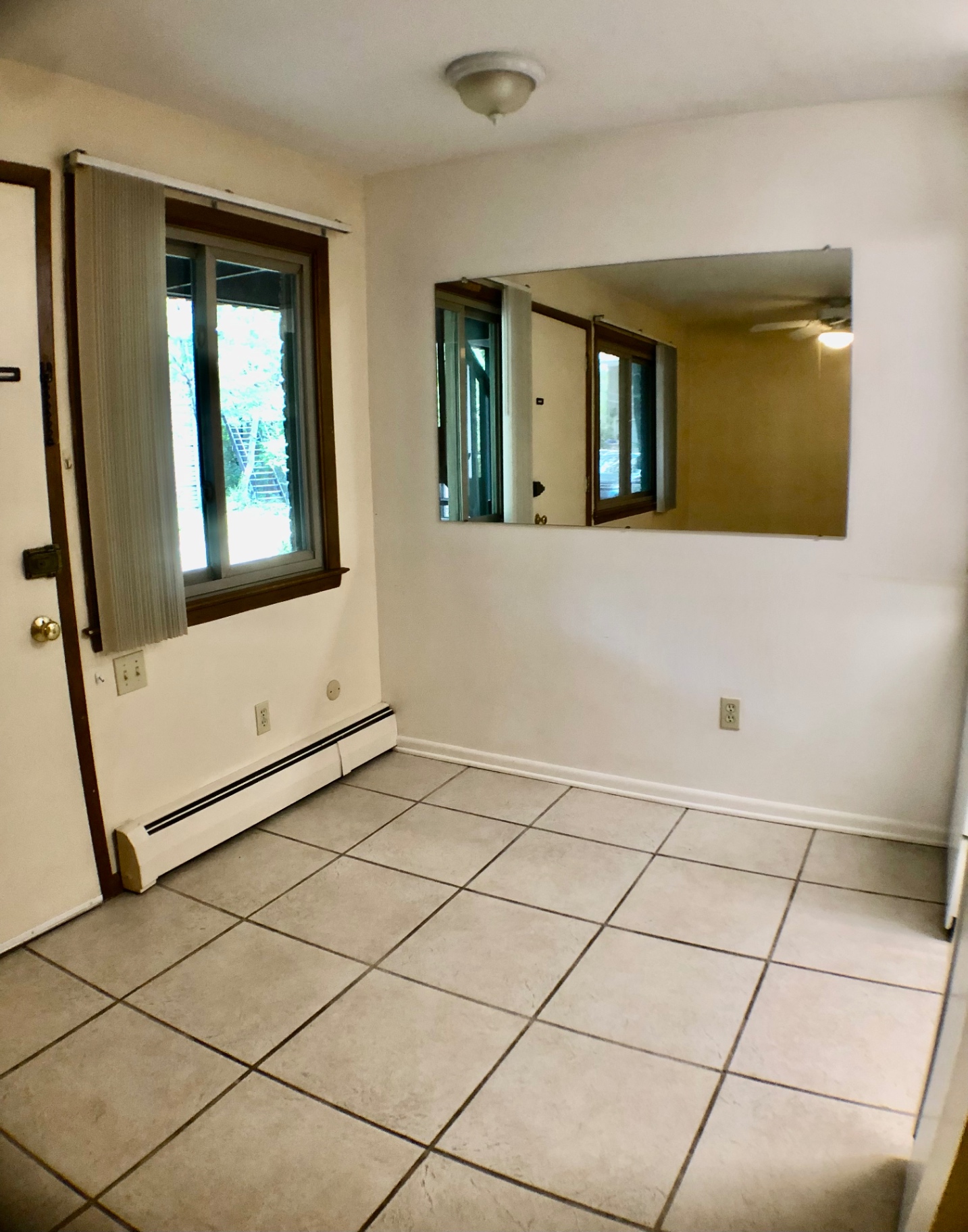 2040 Iuka Ave. 5A entry area with tile flooring, private door, and pass-through window