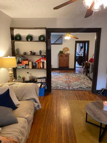 2155 N 4th St. living room with built-in shelving open to dining area