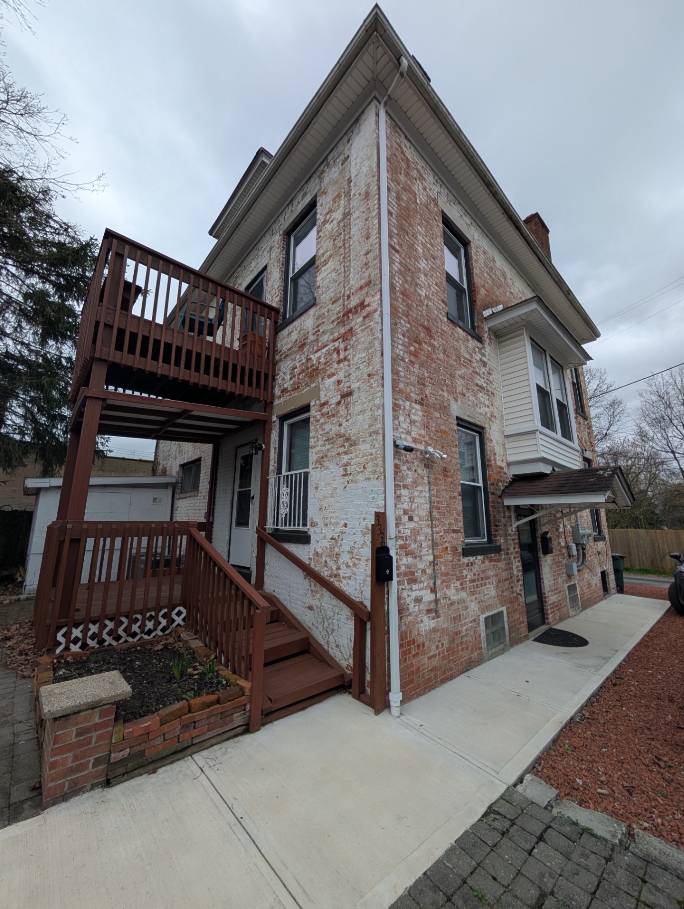 3338 Chestnut side exterior with deck, staircase and bay window