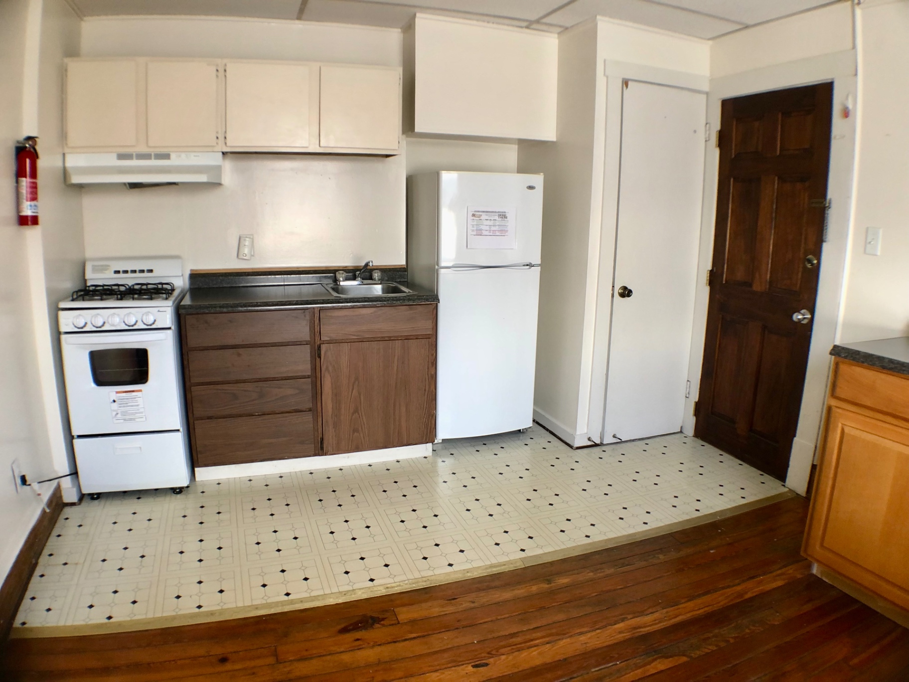 89 E Woodruff Ave. Unit A kitchen with gas range, full-size fridge, and ample cabinet storage
