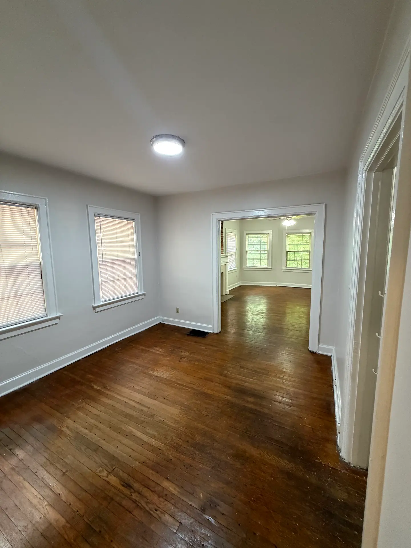 2048 Iuka Ave. D dining room with wide opening into the bay-window living room