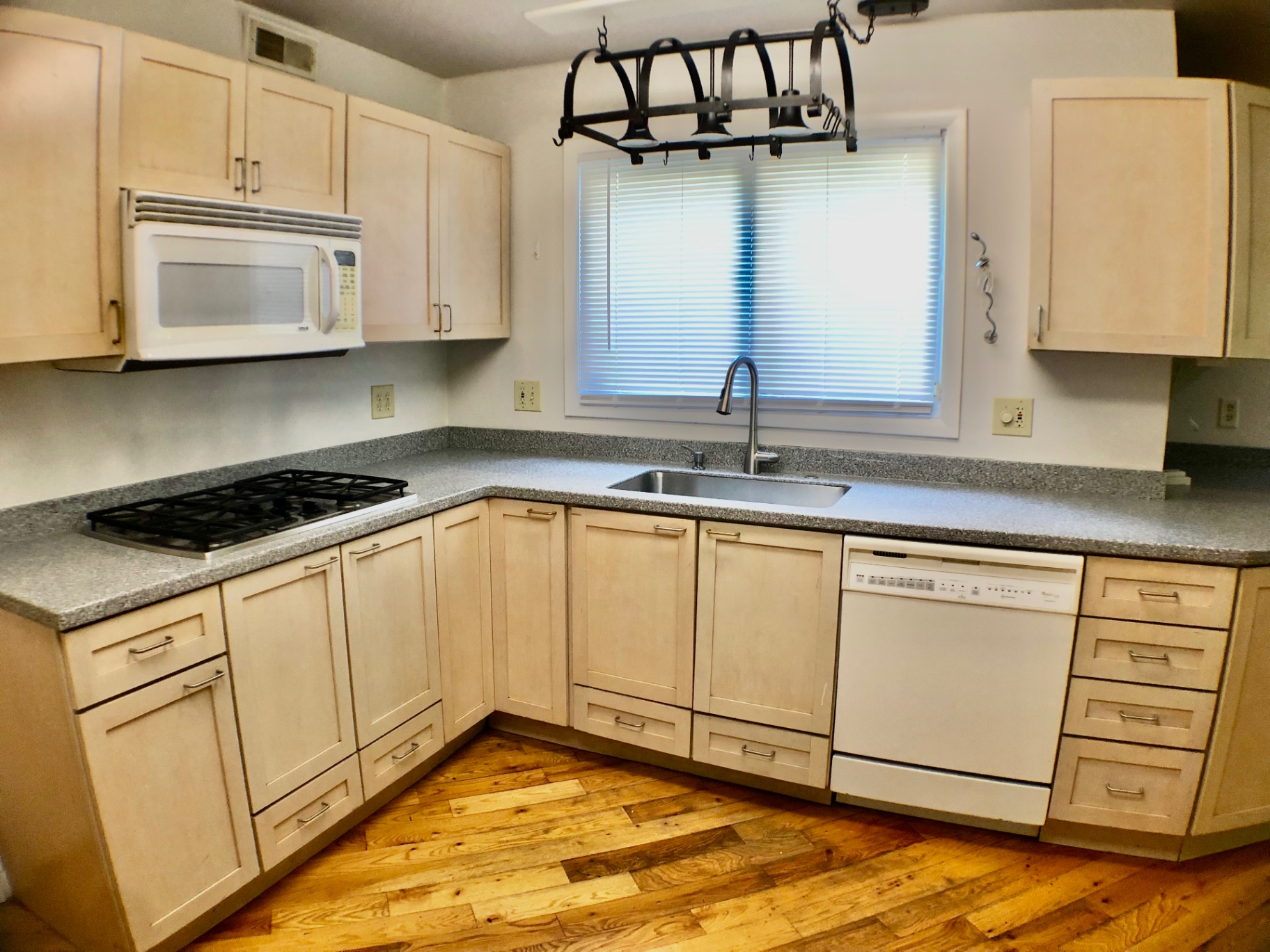 2040 Iuka Ave House kitchen with gas cooktop, dishwasher, and hanging pot rack