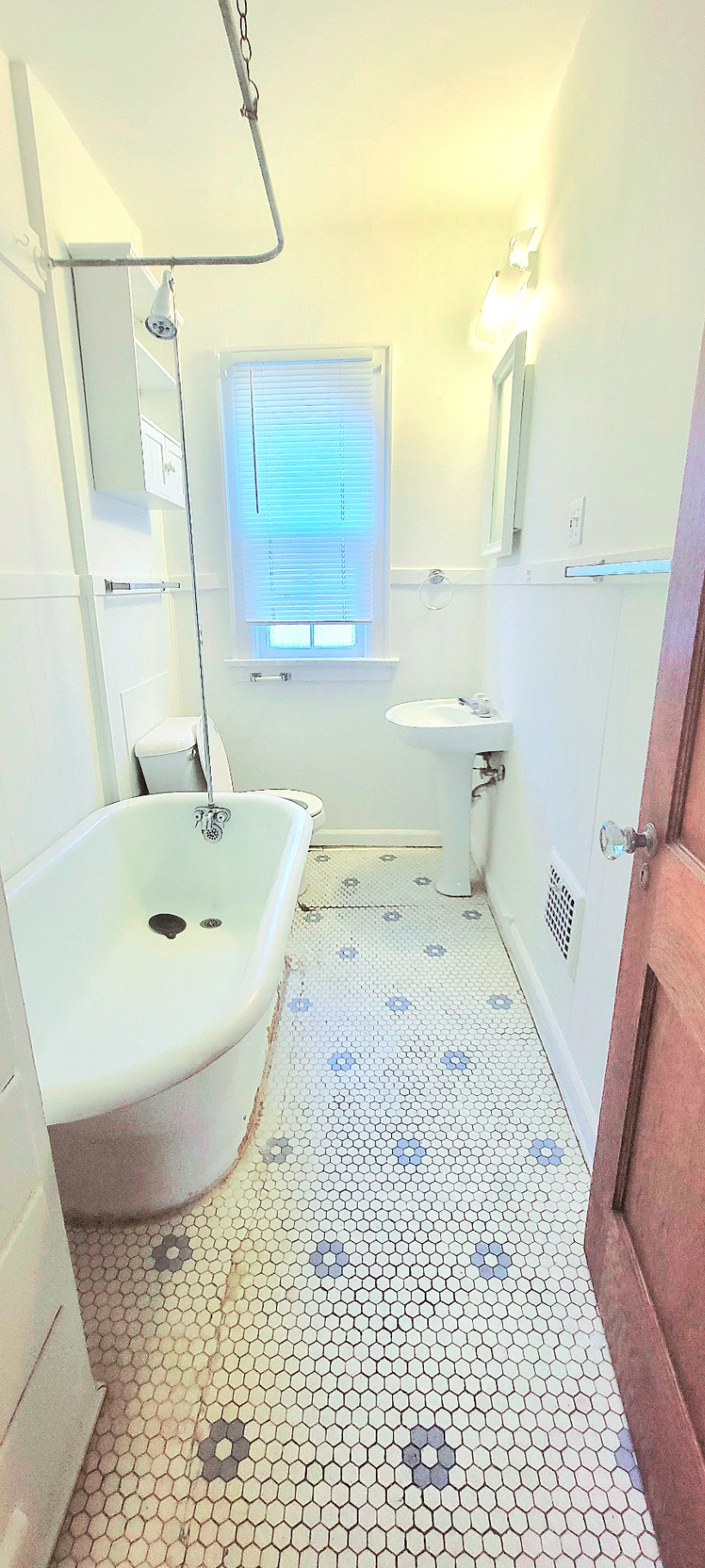 2044 Iuka Ave. C vintage bathroom with clawfoot tub, pedestal sink, and hex tile floor