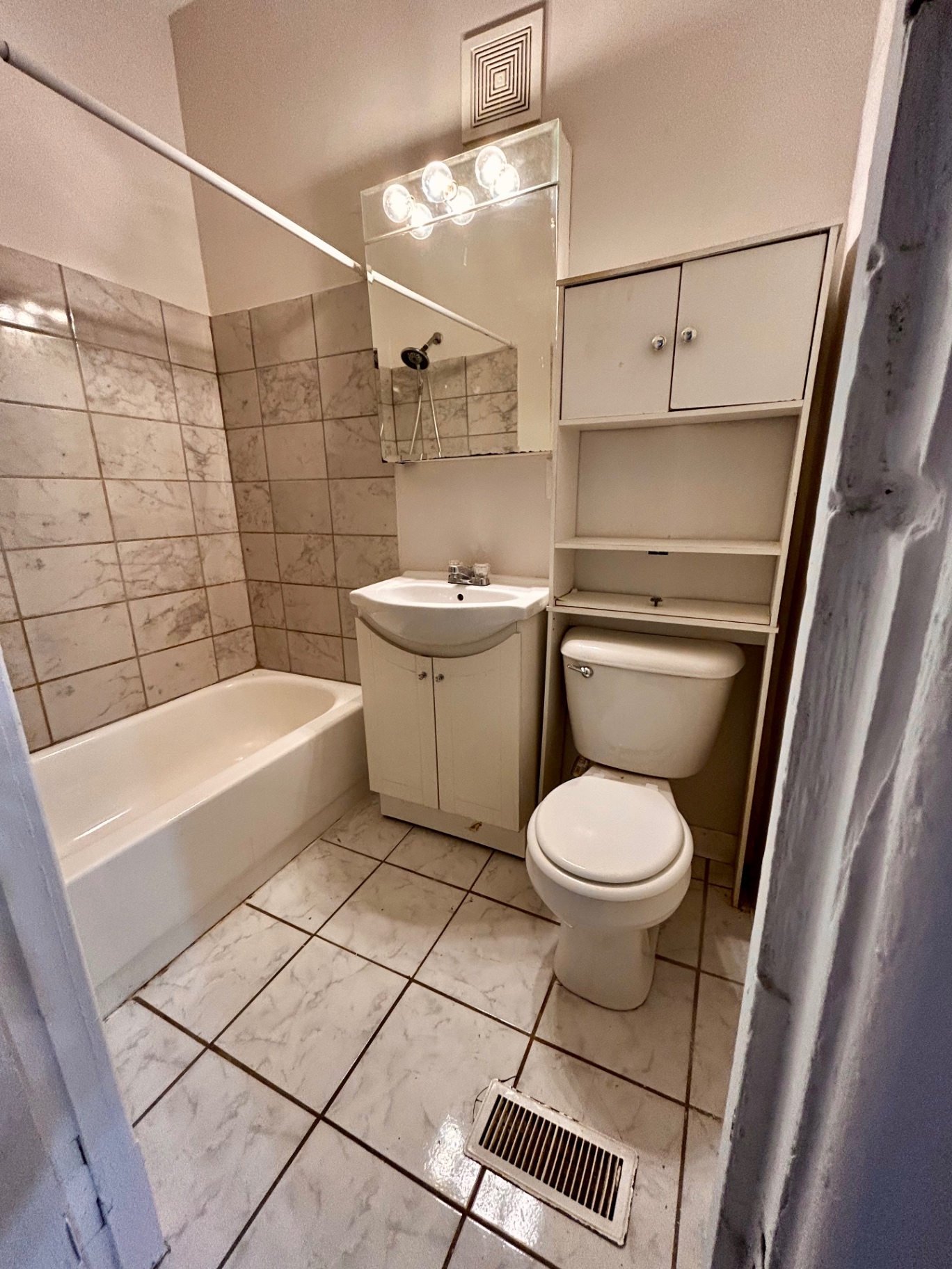 68 E Patterson Ave. second full bathroom with tiled tub/shower and vanity storage